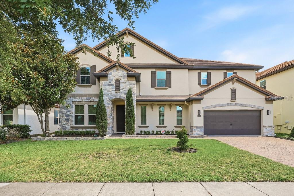 Price Improved & Move-in Ready! - Location! Location! Location! The beautiful 2-story house elegantly sits in the highly sought-after neighborhood Parkside, boasting a split floor plan of total 3641sf heated space with 5 bedrooms, 4 full bathrooms and 3-car garage attached. The Chef's gourmet kitchen features quartz countertops, tall wooden cabinetry and shiny stainless steel built in appliances like cooktop, new refrigerator as well as double ovens, microwave, dishwasher and walk-in pantry. The over-sized kitchen island provides workspace and storage galore, while the combined kitchen and ample living area awaits family gathering. A separate formal dinning room is perfect for intimate dinners or celebrations. Downstairs also situates a bedroom with a full bath. Engineered wood throughout the downstairs common area. Upstairs encompasses the rest 4 bedrooms including the master suite, which generously offers 2 large walk-in closets, a spacious bathroom en suite with double sinks, tub, separate toilet room and shower stall. A laundry room is connected to the en suite. At the center of the second floor sits the spacious bonus room, which separates the master suite from other 3/2 bedrooms/bath. New engineered hardwood floorings flow through all bedrooms. Other features include the Culligan filtration/softening system, Nest living system, and Lawn Sprinkler system. Fully fenced backyard and newly enclosed porch ensure the outdoor party private and fun! This property is amazingly located in Dr. Phillips area, in a convenient proximity to I-4, Disney World, theme parks, shopping plazas, restaurants and many attractions. 30 minutes drive north to downtown Orlando and 30 minutes east to Orlando International Airport. Walking distance to the nearby elementary school. The Resort-style community clubhouse is just around the corner at the entrance, dedicating luxury like large swimming pool, tennis courts, playground, party pavilion, soccer field and a meeting room which can be rented for special events. A real property you can not MISS & A great house can be called HOME!