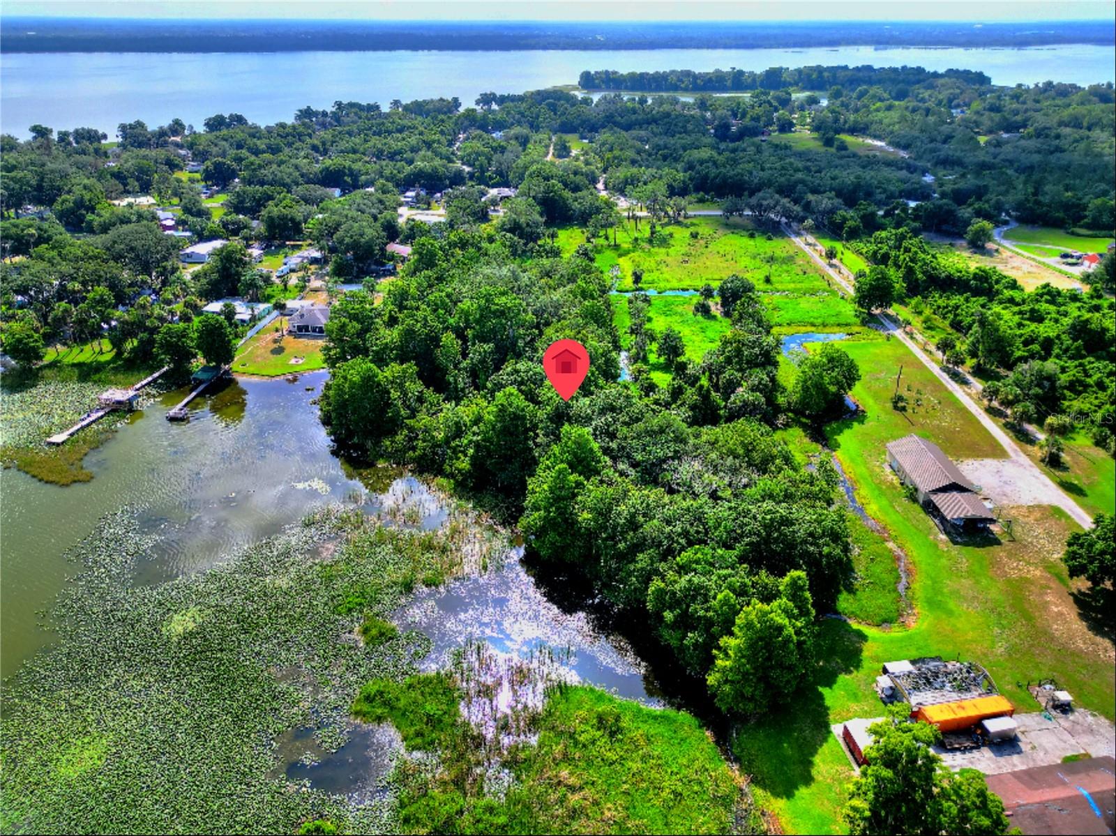 Discover the possibilities with this unique opportunity in the growing Haines City area! This sale includes two parcels totaling just under 3 acres, offering endless potential for your dream home, private retreat, or future investment.

The primary parcel at 1001 Lake Marion Rd W previously had a mobile home, providing a head start for redevelopment. An electrical pole is conveniently located nearby, making it easier to begin your next project. The second parcel fronts Shady Cove, adding additional privacy, flexibility, and value to this one-of-a-kind property.

Enjoy access to beautiful Lake Marion, one of Central Florida's premier lakes, known for boating, fishing, and year-round outdoor recreation. Whether you're looking to build, place a new manufactured home, or simply invest in land with incredible potential, this property offers the space and location to make it happen.

Located just minutes from Haines City, you'll enjoy easy access to shopping, dining, schools, medical facilities, golf courses, and major highways including US-27 and I-4, providing convenient travel to Orlando, Tampa, Lakeland, and Central Florida's world-famous attractions. Haines City continues to experience significant residential and commercial growth, making this an excellent opportunity to secure acreage in one of Polk County's fastest-growing communities.

Don't miss your chance to own nearly 3 acres with lake access, redevelopment potential, and room to create your vision. Schedule your showing today and explore the possibilities!