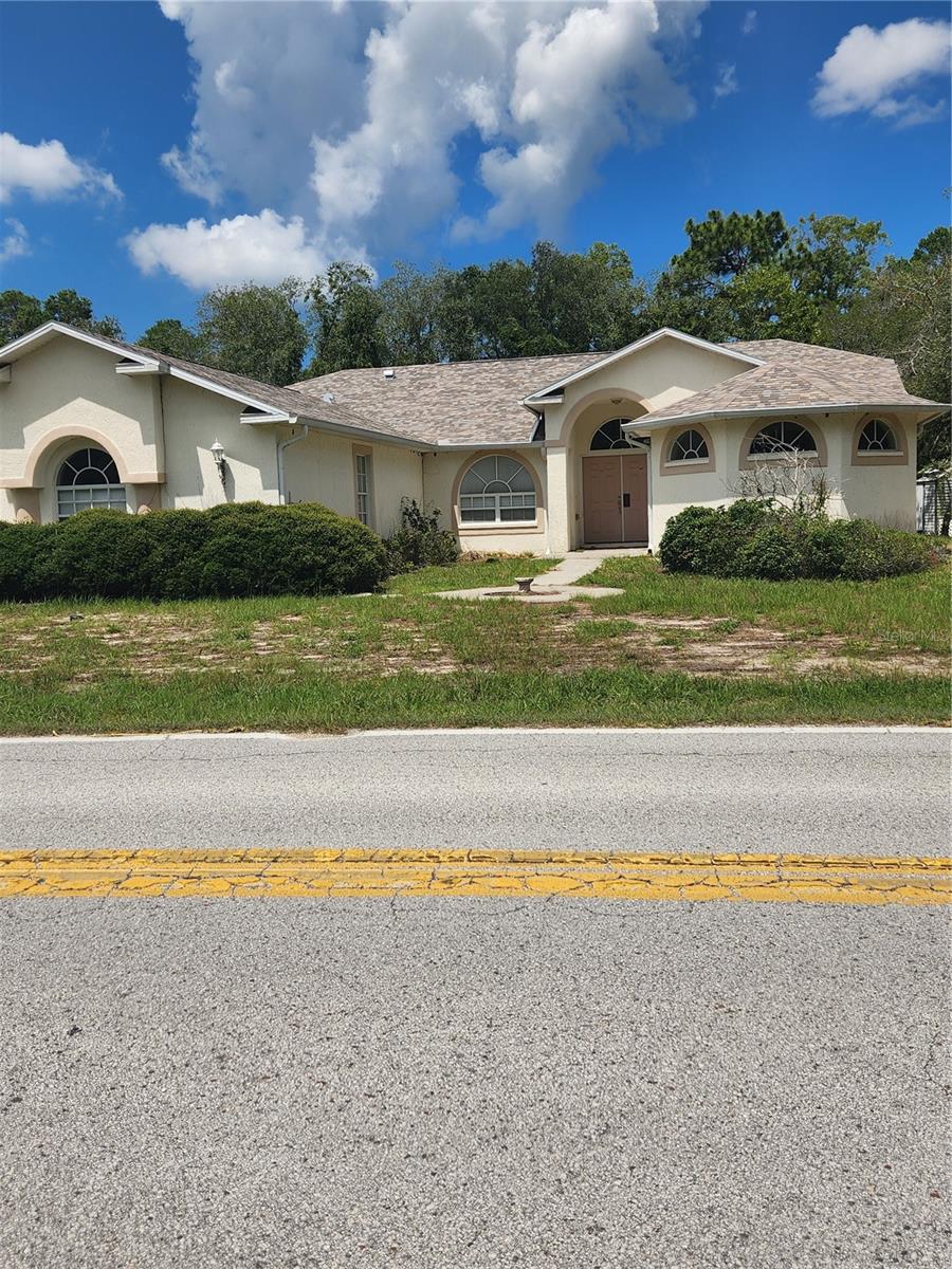 This 2356 heated sq ft. corner lot pool home on .45 acres is ready for a new owner! Enjoy the view of the pool from the Formal Living room, Master Bedroom & Family Room all three have sliding doors to the screen Lanai/pool area.  Lanai is wide for lots of seating and has two ceiling fans to keep you cool. This home offers a three bedroom split plan with 3 full baths perfect for privacy for each family member. Master Bath is a dream with two huge walk-in closets, two separate vanities, a garden tub in the center and a walk-thru shower the width of the bathroom with two shower heads. Kitchen is spacious with closet Pantry and breakfast bar on both the Family room side and the Living Room side perfect for entertaining plus a dinette for just for informal dining.  Laundry room has a wall to wall closet perfect for storage or additional pantry.  Extended three car garage and long driveway provide ample parking for multiple vehicles.  Must see to believe!