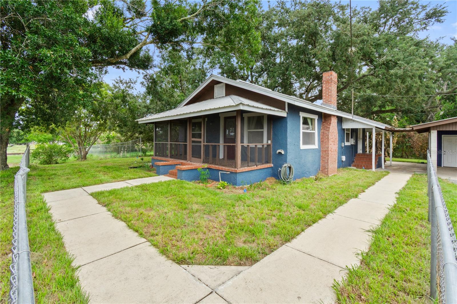 Looking for a charming bungalow in the heart of Frostproof? Look no further! Built in 1925 and thoughtfully updated in 2005, this delightful 2-bedroom, 2-bath home blends timeless character with modern convenience. Major improvements include updated plumbing, windows, roofing, and more, offering peace of mind for years to come.

Inside, you’ll find a spacious open floor plan designed for comfortable everyday living, along with an abundance of storage rarely found in homes of this size. Relax and enjoy Florida’s beautiful weather from the screened front and back porches, perfect for morning coffee or evening gatherings.

The oversized two-car carport includes a convenient laundry area, while the fenced backyard provides plenty of space for pets, gardening, or outdoor entertaining. Whether you’re looking for your first home, a seasonal retreat, or a cozy place to downsize, this charming Frostproof gem is ready to welcome you home.
