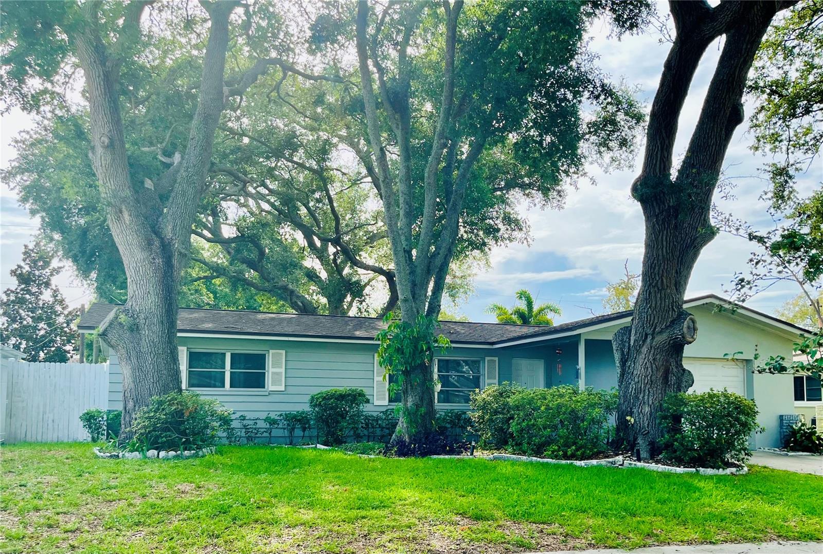 If you've never been to Keene Park then now is the time.  Centrally located, this neighborhood makes living easy, with Clearwater to the North, St. Petersburg to the South, the Beaches to the West and Tampa Bay to the East as there is always something to do.  Keene Park is a desirable, well-maintained community that you can be proud of.  This squeaky clean 2 Bedroom, 1 1/2 Bath home with garage is ready to move into.  The large eat-in kitchen is fully equipped with a stainless-steel refrigerator, range and microwave.  There's a dining area too, giving access through sliding glass doors to a 180 square foot, glass enclosed additional room to enjoy.  Relax in the shade, grill on the patio in your fully fenced in backyard.