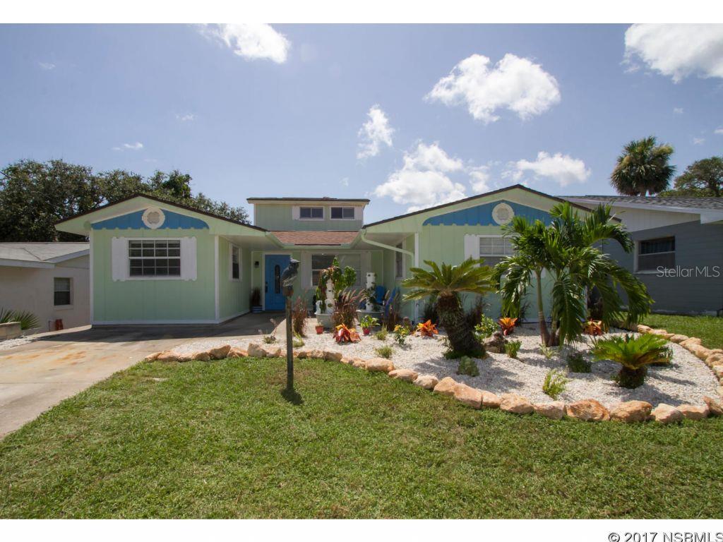 Beachside paradise awaits! This home has loads of character and ample space for family and guests. 3 bedrooms including the master on the ground floor, and a 4th bedroom upstairs that could be used for a media room or office. Enjoy Florida weather in your huge fenced backyard or sit in the light bright Florida room. House was painted in June of '17, master bathroom remodeled July '17, and new carpet in the master. Solar hot water heater helps save on utilities but is hooked up to electric if needed offering a greener option for hot water. The home also has a whole home water softener and a well for irrigation! 14th Avenue has a beach access just a short walk away, as well as the Saxon Dr walking trail just a few doors down. Measurements are approximate. ;Water: City