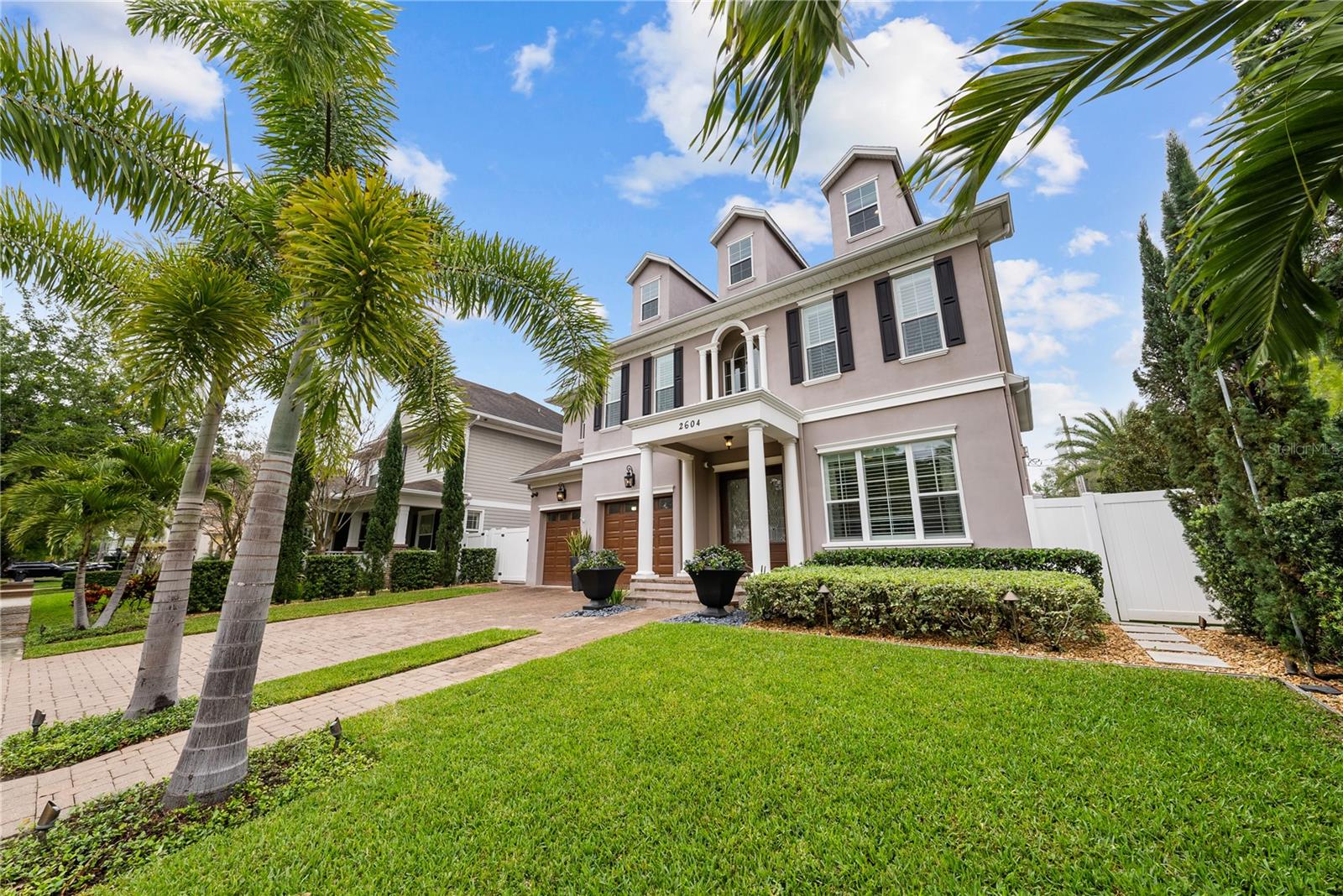 This 5100+foot, 5/4 1/2 three-story Parkland Estates smart-home has it all!  Open the double doors into a two-story foyer and a grand staircase.  Ten-foot ceilings and crown molding is throughout the home and storage galore! A living room and dining room with a double-sided fireplace greet you.  Just down the hall, beyond the powder room and mudroom, is the open-concept chef's kitchen and family room, featuring granite countertops, wood cabinetry, a breakfast area, a new subzero refrigerator and pot filler.  A large walk-in pantry, butler's pantry/bar and wine refrigerator connect the dining room and kitchen. Another door leads to the side yard.  The second floor includes a large primary bedroom and bathroom with a double-entry shower and soaking tub as well as his-and-hers walk-in closets.  There is bonus space with custom built-in cabinetry with lots of storage.  In addition to a laundry room and a media room (and more storage), there are three additional bedrooms with walk-in closets (one is a Jack-and-Jill) and two bathrooms.  The 1000+ sq ft third floor is wide-open!  A great play area for kids, a hangout space for teens, workout area...lots of space to be creative! Custom cabinets and a large closet give more storage possibilities! This home features lots of double-paned windows and natural light, a water softener, a whole-house filtration system, a generator and sound systems in the family room, media room and lanai.  Three new air conditioning systems have been installed recently.  This is one of the most sought-after neighborhoods in South Tampa in the Plant High School district and close to Tampa Prep, Christ the King, and more.  There is even a small park in this very family-friendly neighborhood!