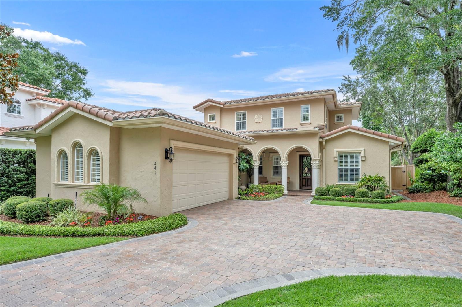 Virtually Staged. A rare opportunity to live on a quiet one-way street overlooking a park in the heart of Winter Park. Built in 2007 and meticulously maintained, this exceptional 4-bedroom, 4-bath pool home with a dedicated office offers timeless design, thoughtful updates, and an unbeatable location.
A welcoming covered front porch provides the perfect spot to enjoy your morning coffee. Inside, soaring ceilings, extensive moldings, travertine and hardwood floors, and abundant natural light create an elegant first impression. Just off the foyer, French doors open to a private office, ideal for working from home. A secondary bedroom and full bath with a walk-in shower are conveniently located on the main level.
The spacious kitchen flows seamlessly into the family room and features granite countertops, solid wood soft-close cabinetry, a gas cooktop, wall oven, breakfast bar, wet bar, walk-in pantry, and a sunny breakfast nook overlooking the lanai and pool. The adjoining family room is anchored by a gas fireplace and French doors leading outdoors.
The covered lanai showcases a tongue-and-groove ceiling and remote-controlled screens, creating the perfect setting for year-round entertaining. The generous first-floor primary suite offers space for a sitting area and features two custom walk-in closets, dual vanities, a soaking tub, separate shower, and private water closet.
A beautiful wrought-iron staircase leads upstairs to two generous en-suite bedrooms and a cozy loft.
The private backyard is designed for relaxation and entertaining, featuring a saltwater pool and spa surrounded by lush landscaping. Additional highlights include two newer HVAC systems (2022 and 2023), a gas water heater (2022), central vacuum system, built-in Home Team pest defense system, and plantation shutters throughout.
Located within the highly sought-after Audubon K-8 and Winter Park High School districts, this exceptional home is ideally situated between Park Avenue and Corrine Drive, with downtown Orlando just minutes away.