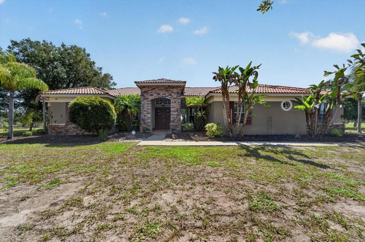 Motivated seller! Experience the perfect blend of space, privacy, and modern updates in this exceptional lakefront home located within a gated community in South Hillsborough County. Situated on a sprawling 1+ acre corner lot with no backyard neighbors, this property offers a peaceful setting with plenty of room to enjoy Florida living.
Featuring over 3,700 square feet, this spacious residence boasts 4 bedrooms, 3.5 bathrooms, a dedicated den/home office, living room, dining room, family room,  breakfast nook, and a 3-car garage. The gourmet kitchen is designed to impress with stainless steel appliances, a large center island, and updated cabinetry, making it ideal for both everyday living and entertaining.
This move-in ready, worry-free home has been meticulously maintained and extensively updated, including a new metal roof being installed in July! (2026), new AC system (2025), septic system serviced (2025), new water softener (2023), new washer and dryer (2024), new refrigerator and dishwasher (2024), updated Wi-Fi irrigation system (2026), new ceiling fans (2025), updated exterior lighting (2025), new Wi-Fi smart garage door opener, and a vinyl dog run fence (2024).
Step outside and enjoy the privacy and endless possibilities this oversized homesite provides. With plenty of room to add a pool, create your own backyard oasis and fully embrace the Florida lifestyle. Enjoy the beautiful conservation easily accessible from the community, walking trails and kayak in the community lake.  Conveniently located near shopping, dining, and major commuter routes, this beautifully updated home offers the rare combination of acreage, privacy, and modern conveniences you've been searching for. Low HOA and No CDD, schedule your private showing today! Check out the photos, 3-D Tour and Video!
