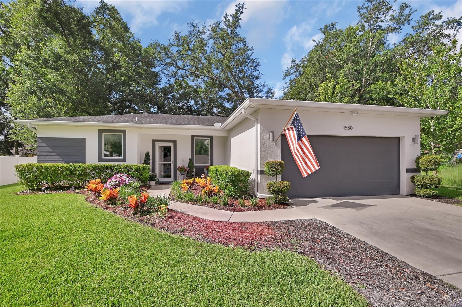 This beautifully maintained home offers outstanding curb appeal and all the Florida charm you've been looking for. The open-concept floor plan provides the perfect balance of togetherness and privacy, with the spacious master situated on one side of the home and two additional bedrooms on the other.

The updated kitchen features new appliances and overlooks the main living area, making entertaining family and friends effortless. Tile flooring runs throughout the main living spaces, while the bedrooms offer the comfort of carpet.

Step outside to your own private backyard oasis. Surrounded by lush landscaping, mature trees, and a fully fenced yard, this outdoor retreat is designed for relaxation and entertaining. Enjoy two gazebos—one covering the patio and another set up as an outdoor kitchen complete with two TVs. Beautiful landscape lighting, a cozy fire pit and serene fountains create the perfect atmosphere for year-round gatherings.