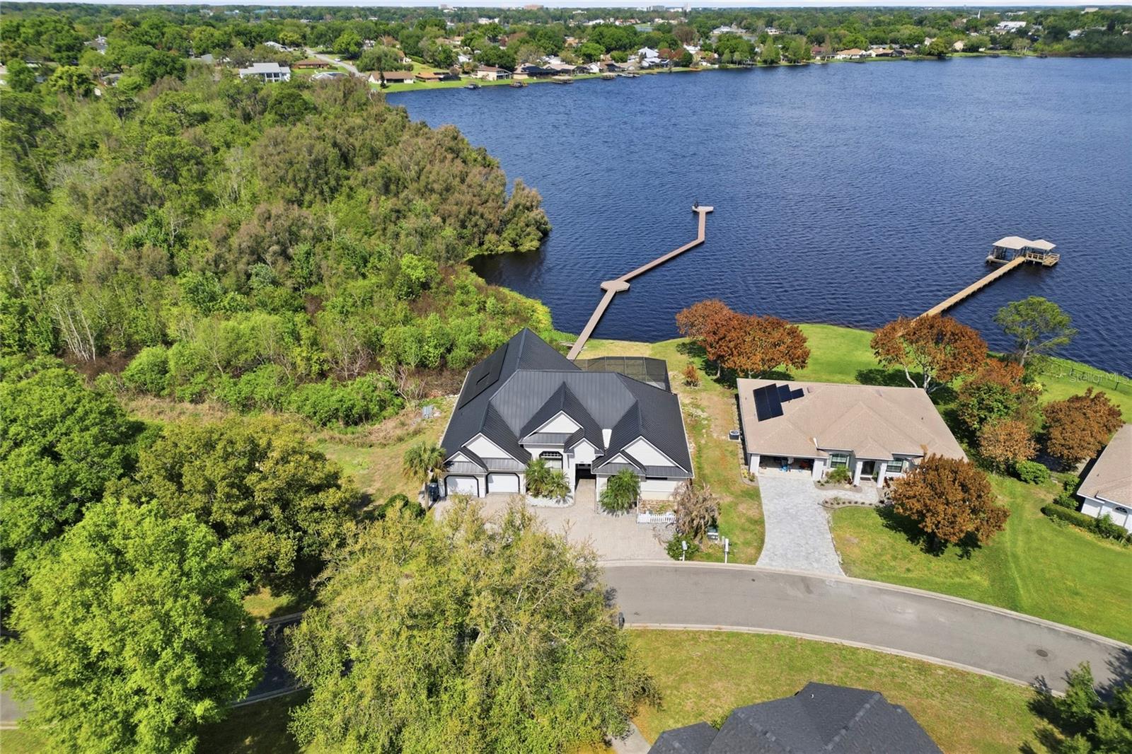 PRICE IMPROVEMENT! Rare opportunity to own one of the BEST LAKE FRONT POOL HOME on Lake Mariam.

Welcome to your slice of LAKEFRONT, LAKE VIEW, POOL HOME paradise on the pristine shores of Lake Mariam in Winter Haven, Florida. This stunning 3-bedroom, 2.5-bathroom home with a versatile BONUS ROOM and a cozy FIREPLACE offers the ultimate Florida lifestyle, complete with direct lake access, a private dock, and breathtaking water views right from your own backyard. 

Built to last and designed for low maintenance, this home features a durable METAL ROOF and solar panels, offering peace of mind and significant savings on energy costs year after year. Whether you're sipping morning coffee by the fireplace, watching the sunrise over Lake Mariam, or heading out for a day on the water, this property delivers the lakefront living experience you've been searching for.

Inside, the thoughtfully designed floor plan offers three comfortable bedrooms, two and a half bathrooms, and a spacious bonus room perfect for a home office, media room, guest suite, or playroom. The heart of the home is the beautifully designed kitchen, featuring abundant cabinetry, stainless steel appliances, granite countertops, a center island, breakfast bar seating, glass-front upper cabinets, recessed lighting, and an open layout that flows seamlessly into the main living areas. With its generous workspace and water views from the adjoining living space, this kitchen is ideal for both everyday living and entertaining.

The oversized 2-car garage provides ample storage for vehicles, watercraft equipment, and all your lake toys. Step outside and discover what truly sets this property apart: your own private HEATED POOL and SPA, along with an impressive private dock stretching out over the serene waters of Lake Mariam, ideal for boating, fishing, kayaking, or simply soaking in the natural Florida scenery. With direct lake access and one of the longest docks on the water, this is a rare find in today's market.

Situated on a 0.33-acre lot in Winter Haven's sought-after lake corridor, you're just minutes from dining, shopping, Legoland Florida, and easy access to I-4 connecting you to both Tampa and Orlando. 

Priced to sell and better than ever, schedule your showing today before this one's gone.