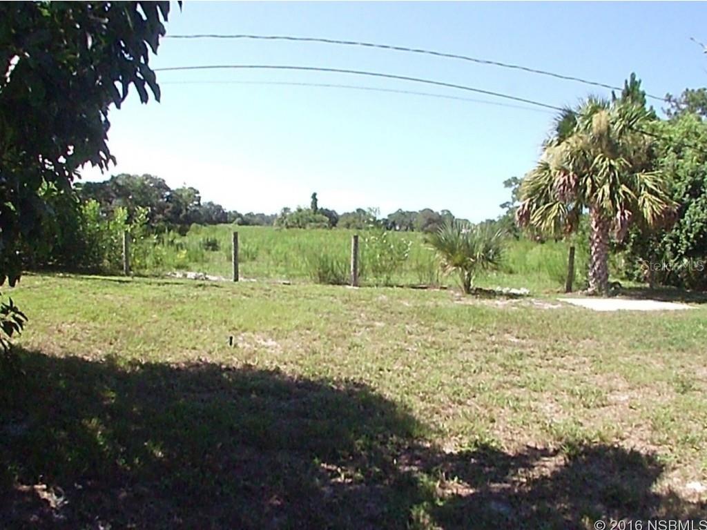 Two bedroom, two bath home backing up to a open field area that is undeveloped and gives privacy.  Laminate wood floors throughout the home.  New roof on home in May 2016.  Screened porch to enjoy the breezes.  Beautiful wood burning fireplace. ;Water: City