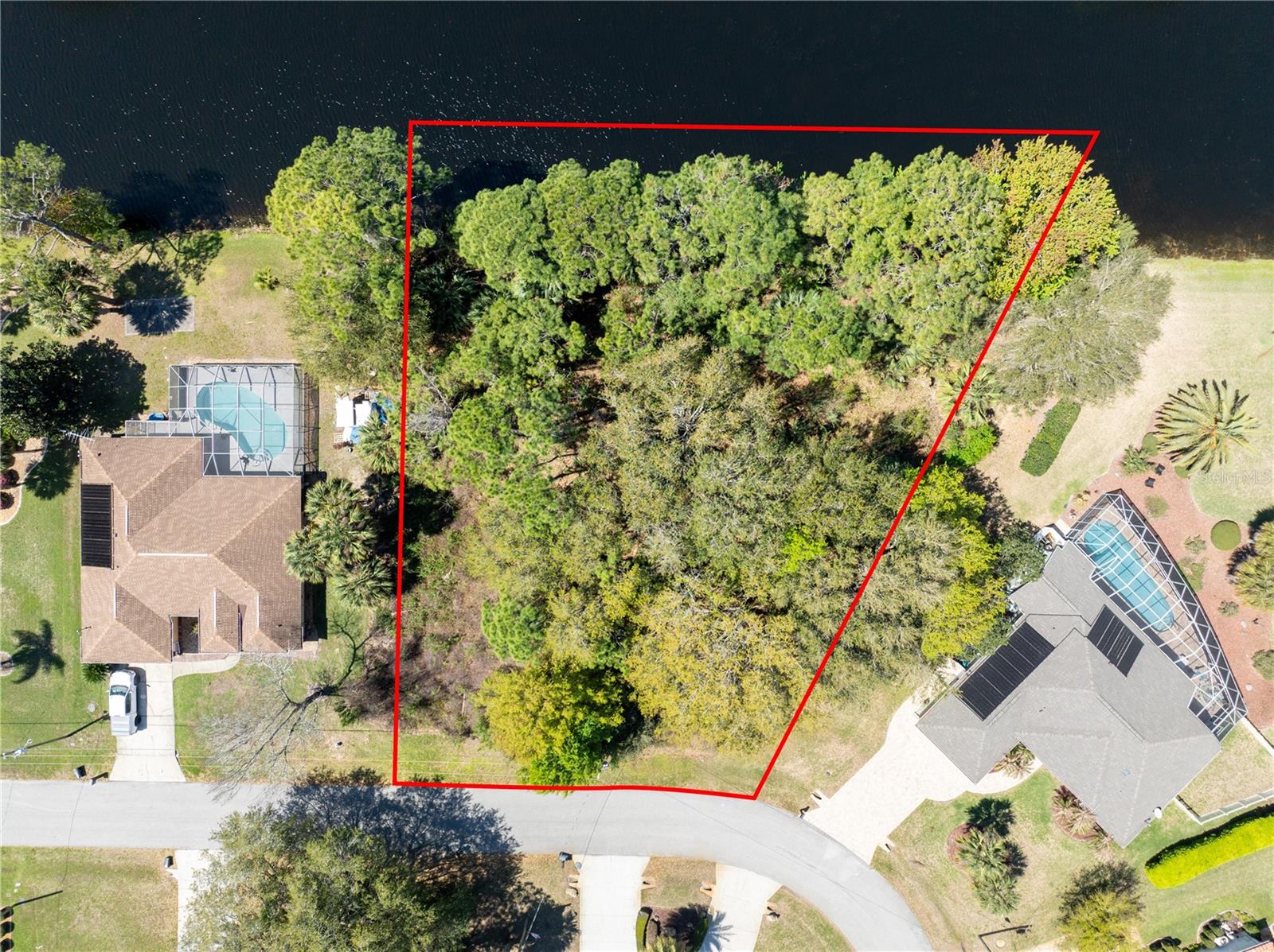 Imagine a homesite that’s simply impossible to ignore, framed by a picturesque lake on one side and a freshwater canal on the other, offering a rare sense of openness, light, and natural beauty; this is the kind of place that makes you pause, take a breath, and instantly feel — this is it, with peaceful water views, privacy, and an atmosphere that defines true Florida living; an ideal setting to build your dream home with expansive windows, a stunning outdoor living space, and mornings that begin with coffee overlooking the water; opportunities like this are rare and always in demand; the location adds even more appeal with convenient access to major roads, shopping, and dining, while maintaining a sense of tranquility and space; nearby schools are well-regarded, making this an excellent option for a primary residence or investment; a unique blend of waterfront lifestyle, location, and potential — the kind of property that captures attention the moment you see it.