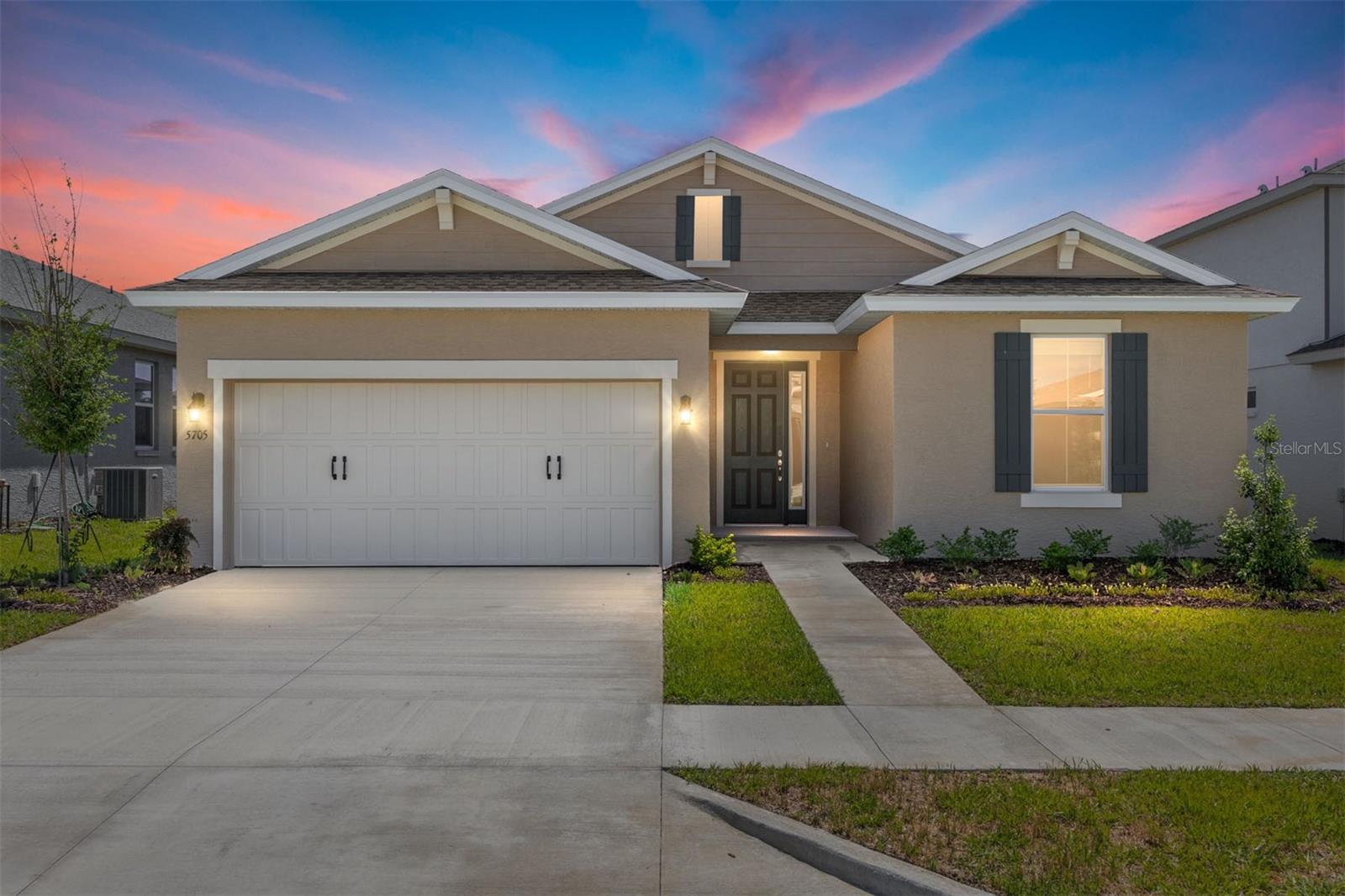 Welcome home to the Amber model in the desirable Calesa Township community. This thoughtfully designed new construction home offers 1,608 square feet of comfortable living space with 3 bedrooms, 2 bathrooms, and a 2-car garage, making it the perfect blend of style and functionality.

The inviting open-concept floor plan features a spacious great room that seamlessly connects to the kitchen and breakfast area, creating an ideal space for entertaining guests or enjoying everyday life. Large windows bring in natural light, enhancing the home's bright and airy feel.

The private owner's suite provides a relaxing retreat with a well-appointed bath and generous closet space, while two additional bedrooms offer flexibility for family, guests, or a home office. A dedicated laundry suite adds convenience, and the thoughtful layout maximizes every square foot of living space.

Step outside to the patio and enjoy Florida's beautiful weather, whether you're sipping your morning coffee or unwinding at the end of the day. With modern finishes, energy-efficient construction, and a prime location within Calesa Township, this Amber model offers the opportunity to enjoy a vibrant lifestyle in one of Ocala's most sought-after master-planned communities.
