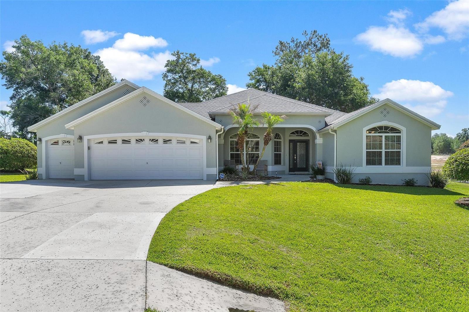 Discover the perfect blend of space, comfort, and convenience with this incredible property situated on over half an acre in a prime location near all the shopping, dining, entertainment, and recreation that The Villages is known for—without the burden of HOA fees or restrictions! This beautifully maintained home offers the freedom and flexibility so many buyers are searching for, all while being close to everyday conveniences and endless amenities. Step inside and immediately feel at home with a spacious and functional floor plan featuring three generously sized bedrooms, two full bathrooms, and a dedicated office that is perfect for working from home, a hobby room, playroom, or even a potential 4th bedroom/guest space. The layout is designed for both comfortable daily living and entertaining family and friends with ease. The heart of the home offers inviting living space filled with natural light and a welcoming atmosphere throughout. The kitchen provides ample cabinetry and workspace while overlooking the main living and dining areas, creating the perfect setup for gatherings and everyday living. One of the standout features of this property is the oversized screened-in back patio, offering the ideal place to relax with your morning coffee, enjoy evening sunsets, or entertain guests year-round while taking in the peaceful backyard views. With over half an acre, there is plenty of room for outdoor activities, gardening, pets, or even future additions like a pool or workshop. ROOF was replaced in 2021. Car enthusiasts, hobbyists, or those needing extra storage will love the spacious three-car garage, providing abundant room for vehicles, tools, golf carts, recreational equipment, and more. Enjoy the rare combination of privacy and elbow room while still being just minutes from The Villages’ renowned golf courses, restaurants, shopping centers, medical facilities, entertainment, and lifestyle amenities. Opportunities like this are hard to find—especially with no HOA, a large lot, and a highly desirable location. If you’ve been searching for a home that offers space, convenience, and freedom all in one package, this property is a must-see!
