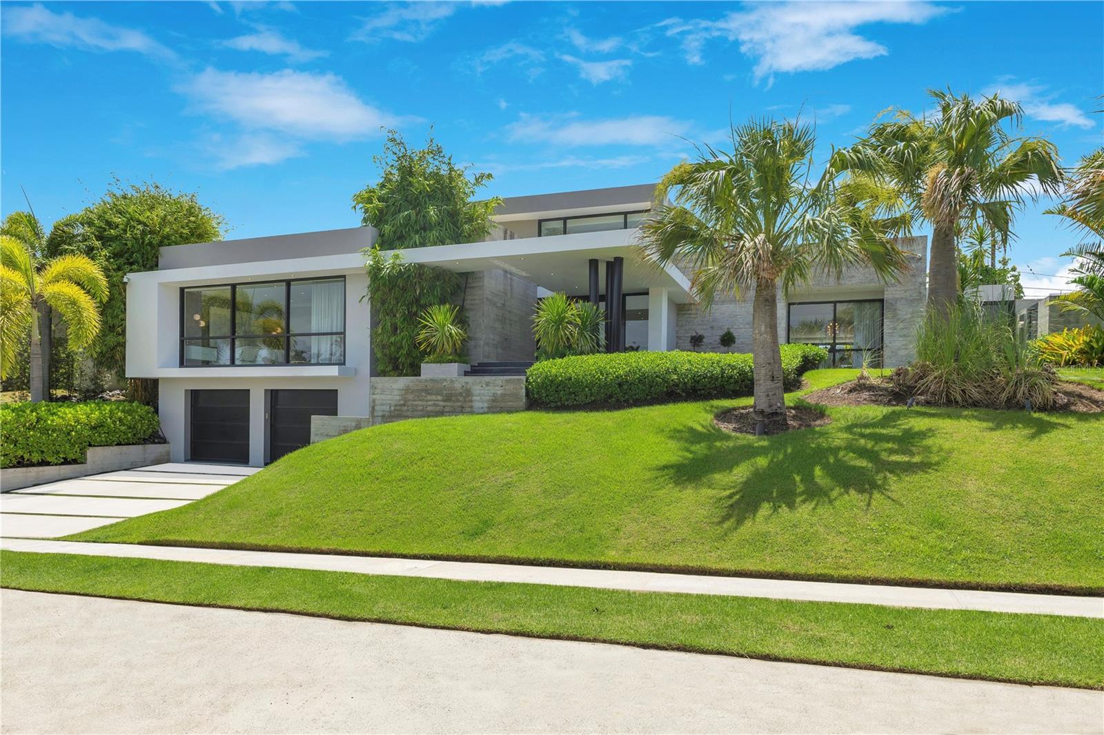 Located in the community of Garden Hills Sur, this 4-bedroom, 4 full and 2 half-bath residence offers 4,489 square feet of interior space set on a 1,050 square meter lot. Designed by JOTA Architects and Pachi García, the home features an open-concept layout that flows into a premium Italian Cesar kitchen, complemented by high-end appliances and a 150-bottle wine cellar. A state-of-the-art smart system controls integrated lighting and audio, while hurricane-rated windows and doors, full power generator and water cistern provide security and peace of mind. Outside, a private terrace with a built-in outdoor kitchen and sleek pool sets the stage for stylish entertaining. The home is offered fully furnished with top-tier designer pieces. CRIM: $4,425 (Annually) HOA: $300 (Monthly)