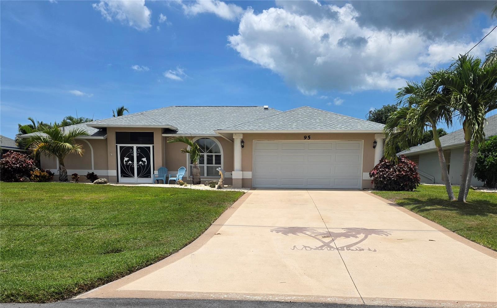 Welcome to your Florida paradise in the highly sought-after community of Rotonda West! This beautifully updated 3-bedroom, 2-bath home offers 1,680 square feet of living space with a desirable split-bedroom floor plan, soaring vaulted ceilings, crown molding, and beautiful tile flooring throughout. A screened double-door entry welcomes you into the bright, open living area designed for comfortable everyday living and effortless entertaining.

The heart of the home is the fully remodeled kitchen featuring gorgeous granite countertops, a breakfast bar, additional counter space perfect for a coffee bar or serving station, abundant storage, and all-new stainless steel appliances. Custom wood plantation shutters accent the front and rear windows, while ceiling fans throughout the home—including the lanai—provide year-round comfort.

Step outside to your private backyard retreat where the heated saltwater pool has been transformed into a true resort-style oasis. Resurfaced in 2023, the pool features premium perimeter tile, stunning abalone shell flecks that create an iridescent shimmer, an expanded coping sun shelf with a fountain nestled between two high-end Polywood lounge chairs, and a new variable-speed pool pump. The entire pool cage was replaced in 2023, complementing the new roof installed the same year. Just outside the screened enclosure, an open patio provides the perfect space for grilling, entertaining, or relaxing under the Florida sunshine. Accordion hurricane shutters protect the lanai for added peace of mind.

Situated on 80 feet of freshwater canal frontage, the property is surrounded by mature trees and lush tropical landscaping, creating a peaceful and private setting. The irrigation system draws directly from the canal, helping maintain the beautiful lawn while reducing water costs.

Additional highlights include a low HOA fee, desirable Flood Zone X, and an open-concept layout with exceptional flow throughout the home.

Ideally located just minutes from Englewood Beach, Boca Grande, and Manasota Key, you'll enjoy some of Southwest Florida's most beautiful Gulf beaches, world-class boating and fishing, championship golf courses, and the charming boutiques, restaurants, farmers markets, and year-round events along historic Dearborn Street in downtown Englewood. This move-in ready home offers the perfect combination of luxury, comfort, and the Florida lifestyle you've been dreaming of.