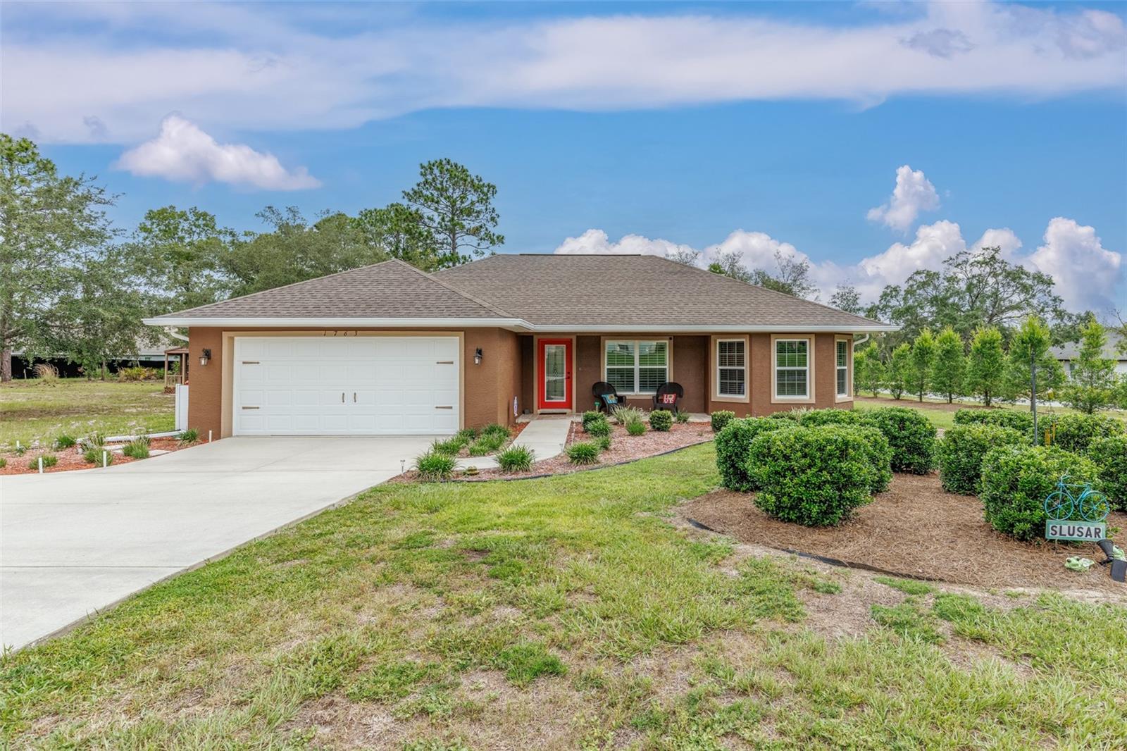 You will feel the love inside this pristine home the moment you step inside! With over ½ acre to
spread out, you’ll want to breath in the outside air and enjoy the beautiful landscaping, outside
lanai space with outside shower, the 12x20 workshop/shed PLUS the 12x16 “she-shed” (maybe
a yoga or art studio?). The inside invites you to an open, split floor plan with stunning features
like cathedral ceilings, crown molding, gorgeous kitchen with upper AND lower cabinet lighting
and breakfast bar. The master suite boasts a designer, walk-in closet with built-in shelves,
drawers and clothes hamper. The master bath has dual sinks, a huge linen closet with plenty of
storage space and the toilet and shower are separate and have a door to the lanai which would
serve well as a pool bath should you decide to add a pool someday! There’s a pocket door
between the great room and the spare or guest area of the home for privacy. Furnishings are
negotiable, as well. The Citrus Springs community offers nearby access to the 47-mile
Withlacoochee State Trail for walking and biking, a community center, tennis courts and park!
The Dunnellon area nearby invites you to enjoy the Rainbow River area for swimming and
kayaking in the beautiful aqua springs! Crystal River is nearby for boating/fishing enthusiasts
with access to the Gulf and swimming with the manage! Also surrounded by golf courses,
shopping and restaurants to add to your lifestyle here in Florida’s Nature Coast area of Citrus County.