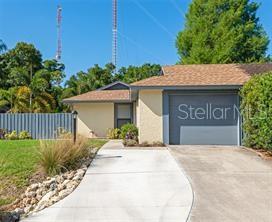 Welcome to this beautifully renovated 2-bedroom, 2-bath home, tucked away on a peaceful cul-de-sac in one of Sarasota's most desirable communities. Thoughtfully updated from top to bottom, this move-in-ready residence offers the perfect blend of modern style, comfort, and low-maintenance living.  A charming covered courtyard greets you upon arrival, creating a private outdoor retreat perfect for enjoying your morning coffee, reading a book, or relaxing with friends. Inside, the open-concept floor plan seamlessly connects the living, dining, and kitchen areas, creating an inviting space for everyday living and entertaining.
The stunning kitchen features quartz countertops, shaker-style cabinetry, designer backsplash, stainless steel appliances, modern fixtures, and an oversized center island that serves as the heart of the home.
The desirable split-bedroom layout provides privacy for owners and guests alike. The spacious primary suite offers a custom walk-in closet and a beautifully designed ensuite bath with a luxurious walk-in shower and designer tile finishes.
Beyond the main living area, a versatile bonus room provides the perfect space for a home office, den, hobby room, or additional entertaining area. Sliding glass doors lead to a second enclosed patio overlooking the lushly landscaped backyard and expansive paver deck—an ideal setting for outdoor dining, grilling, and gatherings year-round.

Additional features include an attached one-car garage, dedicated laundry area, and mature landscaping that enhances the home's serene setting.

Ideally located just minutes from shopping, dining, parks, and everyday conveniences, and only a short drive to Sarasota's world-famous beaches, this exceptional home offers the Florida lifestyle you've been dreaming of. One look and you'll feel right at home.
