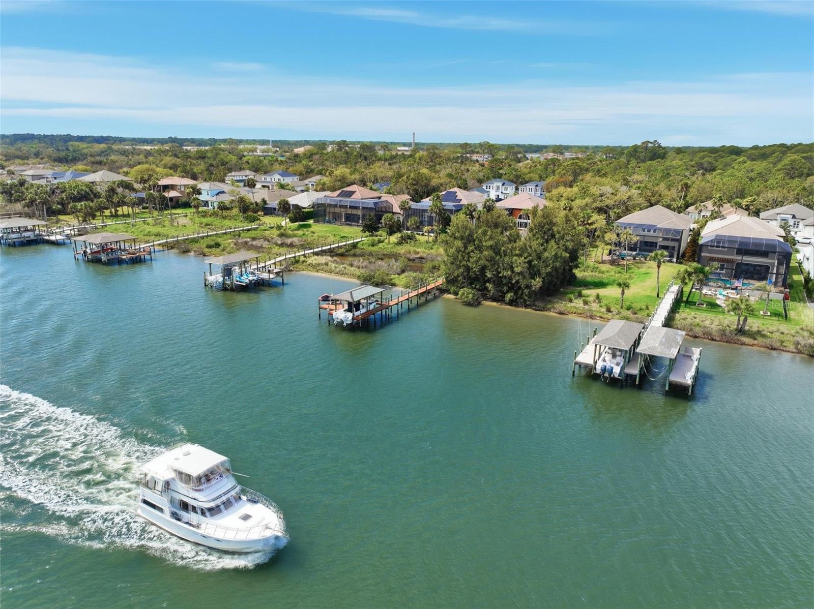 Now is your chance to purchase a waterfront lot and build your dream home in Palm Coast Plantation. Lot includes shared boat dock on intracoastal waterway. You just need to build your own boathouse. Lot is within this luxurious gated community that features gate, tennis, pickleball, pool, fitness, trails, boat ramp on lake, clubhouse and benches to enjoy the view of the intracoastal.
