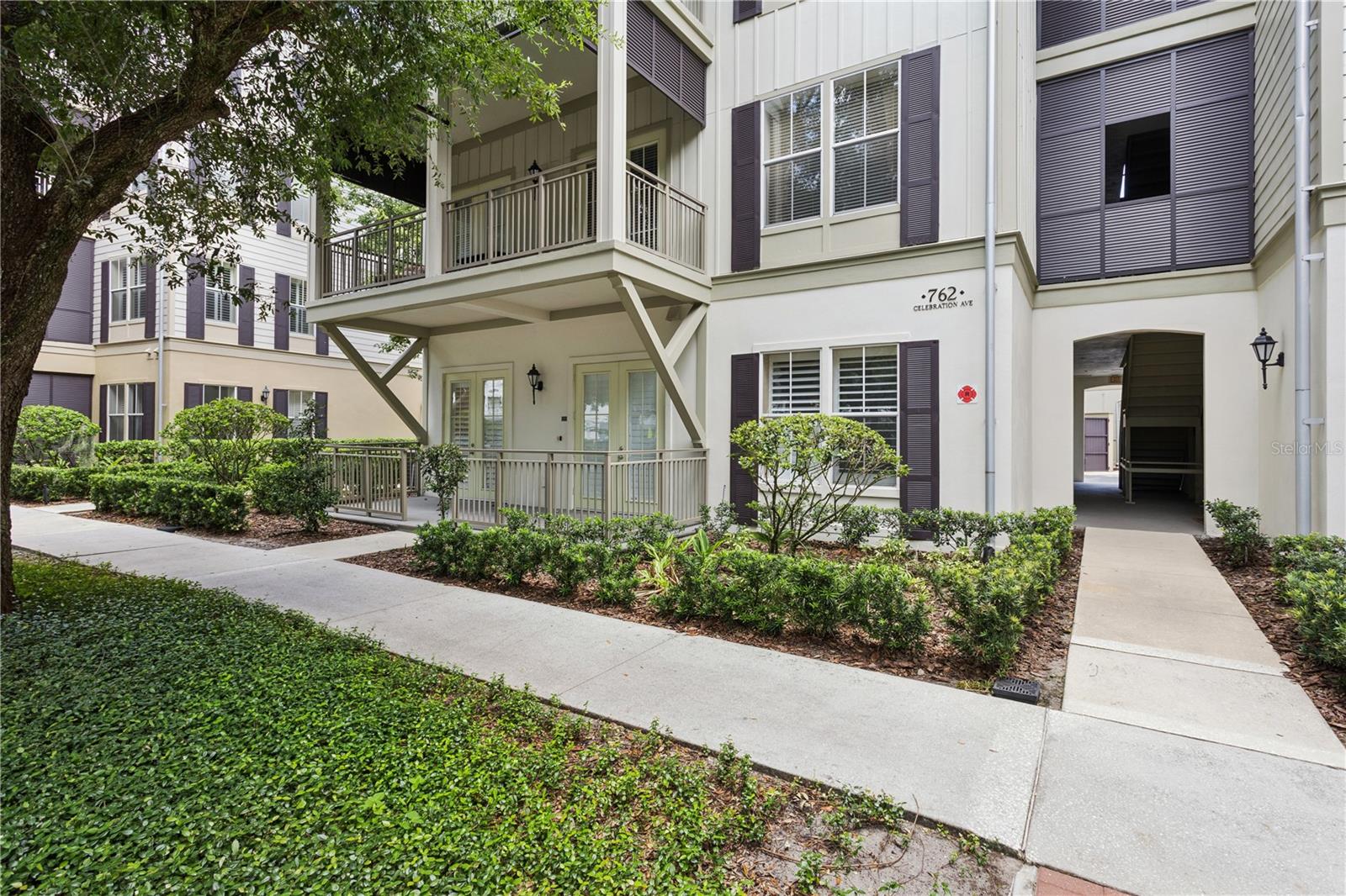 Experience refined living in one of Celebration’s most desirable condominium residences, offering exceptional privacy with three sides free of adjoining neighbors. This impeccably maintained 2-bedroom, 2-bath home also features a versatile flex room, ideal as a private office, library, media room, or additional guest space.

Designed for both everyday comfort and entertaining, the open-concept floor plan showcases a well-appointed kitchen featuring granite countertops, 42-inch cabinetry, a closet pantry, breakfast bar, and a separate dining area that flows seamlessly into the spacious living room.

The primary bedroom is surrounded by windows that fill the space with natural light and includes an oversized walk-in closet. The spa-inspired bathroom offers dual marble vanities, a relaxing garden tub, and a separate glass-enclosed shower. The second bedroom features a walk-in closet and separate bathroom with tub.  

Additional highlights include an interior laundry room, a private covered balcony overlooking Veterans Park, and the rare convenience of a detached one-car garage located just steps from the residence.

Located just moments from the vibrant heart of downtown Celebration, residents enjoy charming boutiques, acclaimed restaurants, scenic walking trails, waterfront parks, and a full calendar of signature community events throughout the year. Lakeside Park amenities include a heated swimming pool, tennis and basketball courts, and a playground.

Ideally positioned approximately 10 minutes from Walt Disney World Resort, 20 minutes from Orlando International Airport, with convenient access to I-4 and Florida’s renowned Atlantic and Gulf Coast beaches, this exceptional residence offers the perfect blend of privacy, convenience, and the celebrated Celebration lifestyle.