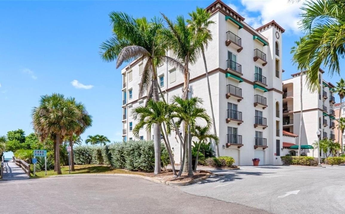 Price Improvement! Paradise on Treasure Island is calling with this large corner unit condo, complete with an oversized balcony to maximize your sunset viewing. As a bonus the Condo sits back a block off of busy Gulf Blvd. There are unobstructed views from above the tree tops and the Gulf is visible from the primary bedroom, living areas and kitchen. No detail overlooked with this mostly furnished, turn-key meticulous unit. Living area floors are Italian ceramic wide-plank tiles. Bedrooms, all with luxurious carpet. The Kitchen features Turkish Emperador Granite counters and glass tile backsplash. Stainless GE Elite appliances, and the refrigerator is brand new. Convection oven and convection microwave. Custom 42” cabinets, with under cabinet lighting. Breakfast Bar and Wine Cooler complete this beautiful space. The open floorplan is spacious and perfect for entertaining. The two guest bedrooms can be closed off behind French doors to make a private suite. There is a second entrance from this area as well. All bedrooms have en-suite bathrooms. There is a Powder bath for convenience just inside the main entrance to the condo as well. Primary suite has volume ceilings, Gulf views, balcony access, and his and hers walk-in closets. Primary bath has Italian tile, dual Kohler sinks, granite, glass enclosed shower, Kohler tub, toilet & bidet. Property is protected by Simonton Stormbreaker Cat 5 hurricane windows and newly installed Sliders. There are Rolladen electric hurricane shutters too so the condo and the balcony furniture are both secure. Ground floor, you have a dedicated, secure, private oversized single-car garage. Lots of room for the beach toys, even a golf cart. This beautiful condo in a smaller boutique community is for the most refined buyer who is longing to enjoy their own piece of paradise! Don’t delay, schedule today.