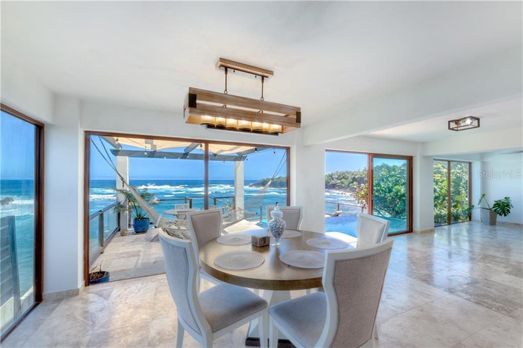 Sitting sandfront on Playa Tocones in Cap del Mar, 10 Bonito Street captures the absolute awe of the Caribbean sea from every vantage point. A three story ocean front home, the property offers 5 bedrooms, 3.5 bath and direct access to the beach. The first floor offers an open living, dinning, den and kitchen that lead out to the pool and sun deck, sitting 50 ft above the sand. Three bedrooms are located on the second floor, two of which share a large bath, and offer balconies to the south. The third floor, accessible by separate entrance with private stairs, offers 2 bedrooms, 1 bath, full kitchen living, dining and full beachfront terrace.

A privileged location in Cap del Mar, this rare to find beachfront street offers only few residences, sand access from their private stairs, is a short 5 minute drive from the surrounding resort of Dorado Beach, and is one of the more famous surf and snorkel beaches in Puerto Rico.

The home is currently leased on a short term basis and requires more than a 48hr notice to book an appointment to tour.