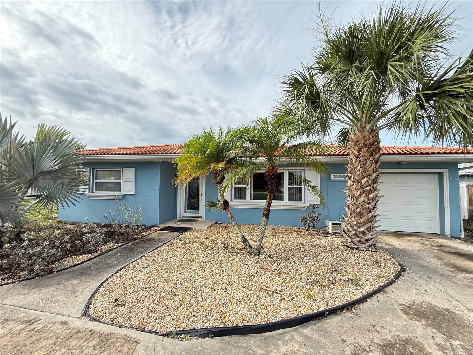 Welcome to this beautifully maintained pool home situated on a spacious corner lot spanning 0.21 acres in one of Largo's most convenient locations. With no HOA restrictions, high elevation, and plenty of room to bring your boat, this property offers the flexibility and Florida lifestyle that so many are searching for. Double pane windows, sturdy tile roof (2006), new flat roof (2026), newer HVAC. (2023) and hurricane panels all offer peace of mind.  Offering over 1,400 square feet of living space with 3 bedrooms and 2 bathrooms, the thoughtfully designed floorplan provides both comfort and functionality. Stepping inside, the open concept living room flows seamlessly into the dining area just off the kitchen, creating an inviting space for everyday living and entertaining. The kitchen features granite countertops, ample cabinet space, and barstool seating for casual dining. Towards the rear of the home, a versatile bonus room offers additional living space and is accompanied by a full bathroom featuring a glass-enclosed walk-in shower, with a bedroom conveniently located just across the hall. The split bedroom floorplan allows for added privacy, while the additional bedrooms are centered around the second full bathroom. Step outside and discover your own private backyard retreat. The expansive fenced yard features a covered patio complete with a ceiling fan, making it the perfect spot to relax year-round. The pavered patio surrounds the heated pool and spa, creating an ideal setting for entertaining family and friends. Adding even more charm to the outdoor space is a peaceful koi pond, while a large storage shed provides plenty of room for tools, lawn equipment, and additional storage needs. Just minutes away, Taylor Park provides scenic walking trails, a freshwater lake, playgrounds, picnic areas, fitness stations, and abundant wildlife. Here you’ll have access to highly sought-after A-rated schools, while residents also enjoy being close to Largo Central Park, home to community events, concerts, holiday celebrations, and year-round activities. The nearby Largo Sports Complex, Highland Recreation Complex, and Pinellas Trail offer even more opportunities for fitness and outdoor recreation. Daily errands are effortless with Publix, Target, Seminole City Center, and a variety of dining and shopping destinations just a short drive away. Healthcare facilities including Morton Plant Hospital and Largo Medical Center are conveniently nearby. For beach lovers, the sugar sand shores of Indian Rocks Beach, Belleair Beach, and Clearwater Beach are only minutes away, making sunset walks and weekend beach days part of everyday life. Short-term rentals are allowed, making this an exceptional investment opportunity. With its private heated pool and spa, spacious corner lot, proximity to Gulf beaches, Taylor Park, shopping, and top-rated schools, this home offers the features today's vacation renters are actively seeking. This is a rare opportunity to enjoy the best of the Florida lifestyle. Schedule your private showing today.