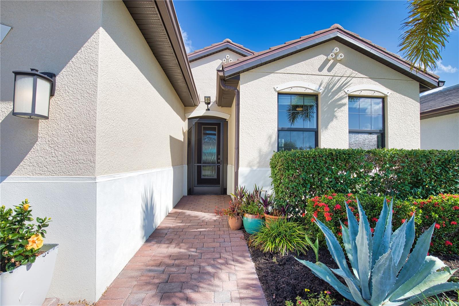 Welcome to The Preserves of Wellen Park! a stunning 3-bedroom, 2-bathroom Saltwater HEATED POOL home. This home  located on a prime corner lot in the highly sought-after maintenance free community of the Preserve at West Villages within Wellen Park, a golf cart friendly community. This remarkable home has an inviting foyer that sets the stage for a bright and open floor plan designed for both sophistication and comfort. Close the Custom Barn Door and have a 2nd PRIVATE EN-SUITE! The heart of this home is the kitchen, with custom Board on Board wood accents, Carrara marble backsplash, over and under cabinet lighting, featuring granite countertops, large kitchen island, stainless steel appliances, and a spacious corner pantry—perfect for all those large items!. Flowing seamlessly into the outdoor living and dining areas, this home offers a large lanai for all your entertaining needs, Plus an Outdoor Pool! with a outdoor grill island and mini refrigerator for keeping everything cold while soaking in the pool!  surrounded by LUSH, tropical landscaping, offering the ultimate in privacy. Retreat to the primary suite located at the rear of the home, where you’ll find a large  walk-in closet and en-suite bath with dual vanity sinks, a walk-in shower, and a water closet. The Preserve at West Villages in Wellen Park is a charming and gated, maintenance free community offering well-manicured single family homes and villas. Residents enjoy a private clubhouse, equipped fitness center, heated resort style pool and bocce ball and pickleball courts. The home’s ideal location puts you just minutes from the vibrant downtown of Wellen Park which features shopping, dining, and community events including farmers markets, live music, and many other social activities, as well as the CoolToday Park - home to the Atlanta Braves Spring Training Stadium! Just a quick drive to the historical downtown Venice, our local sparkling beaches and easy access to Interstate 75. This is more than just a home; it's a lifestyle waiting for you! Lanai Bar, Grill Island, can be included, Owner is a Real Estate agent