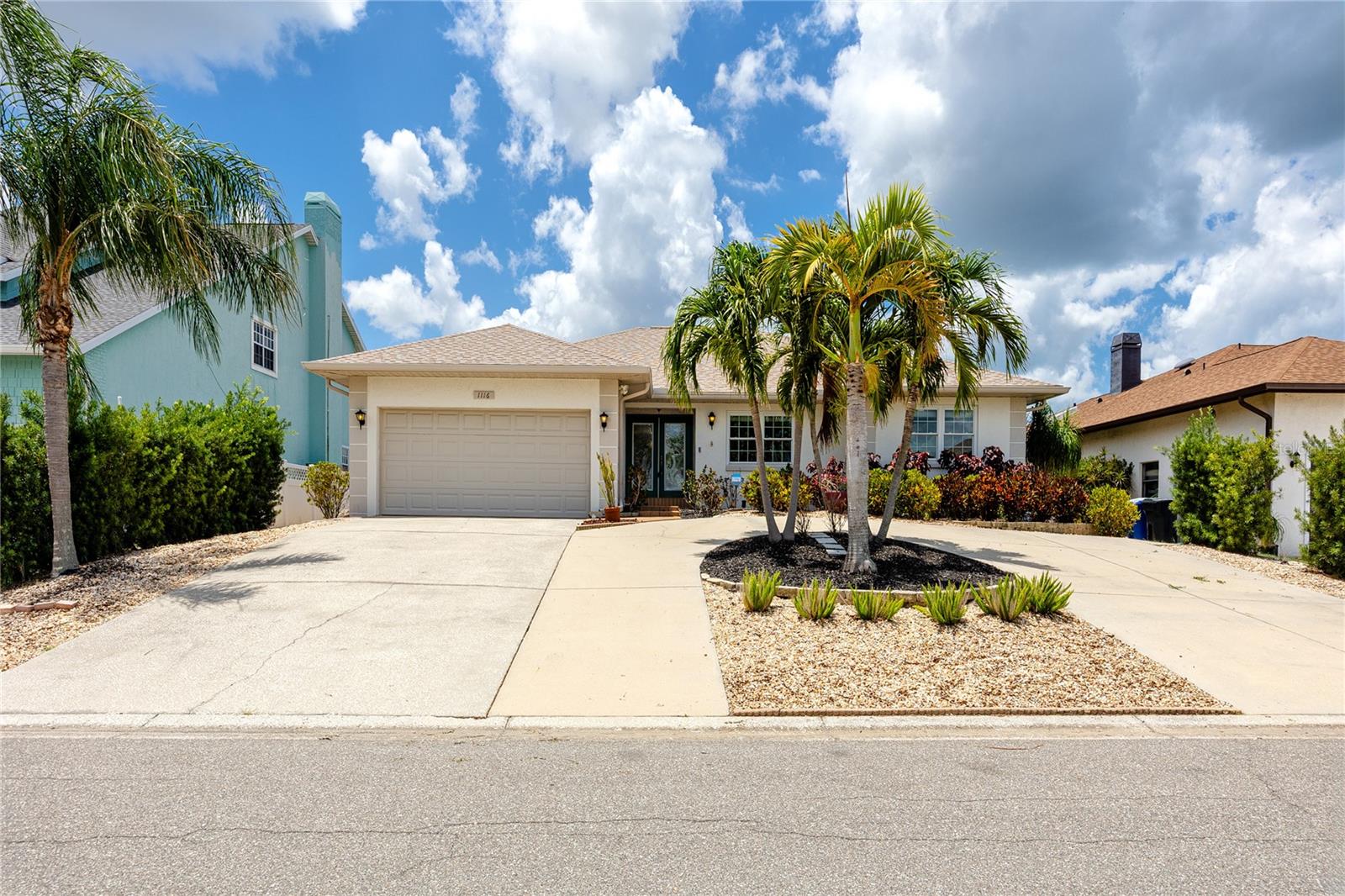 Apollo Beach living at its finest with this well-maintained 3-bedroom, 2-bathroom waterfront pool home. Step through the primary bedroom's French doors in the morning to the covered lanai with its warm wood-plank ceiling and freshly sealed paver deck for a cup of coffee and enjoy the tranquil canal views that frame the full back of the property.

Inside, the main living area flows into a custom bar with a wood soffit and new recessed lighting overhead that anchors the kitchen and living room as the social center of this open floor plan. The kitchen features wood-inlay countertops freshly sanded and resealed, a new refrigerator, and an adjacent dining room with a full bay of windows. Vaulted ceilings carry through the living space, and hardwood floors run consistently across the main areas.

The primary suite is nearly 20 feet across with two walk-in closets and a full en suite: dual vessel sinks on granite, a private water closet, and a glass-enclosed shower. The guest bath matches the attention to detail with full-height tile, a glass block window, and a copper vessel sink on granite. Both guest bedrooms are independently accessed and well-sized. Inside laundry and a two-car garage round out the practical side.

The backyard is designed for enjoyment. The covered lanai runs the width of the house under a tongue-and-groove wood ceiling with a coastal ceiling fan overhead, providing a shaded sitting area with water views fully visible through the screened pool enclosure. The paver deck has been sanded and sealed, the pool sits center in the enclosure, and the screened cage runs nearly 50 feet across the property line. Past the enclosure, a path through the palms leads down to the dock. Two Adirondack chairs face the canal at the water's edge. The lift is operational and ready, with both motors recently replaced, a new control panel installed, and the [3,000 lb?] lift fully serviced. Neighboring boats are visible in both directions. The canal connects out, and the Gulf and Intracoastal are both a short run from here.

Practical updates have been managed, offering peace of mind. The roof was replaced at the end of 2024, the AC and water heater are both under three years old, and all exterior plumbing above grade has been replaced. Every outlet and switch plate is new, and a whole-house generator is installed and wired to run the full home, air conditioning included, without interruption. New exterior floodlights offer an additional level of security, and the system is wired and ready to activate.

Then there's the elevation. This home sits measurably higher than its neighbors — visible from the street — and did not flood during the 2024 storm season.

Located in Apollo Beach with quick access to Tampa Bay, the TECO Manatee Viewing Center, Little Harbor at Ruskin, and the SouthShore corridor. Downtown Tampa and MacDill Air Force Base are both reachable in under 30 minutes via I-75, and Tampa International Airport is roughly 25 miles north.
