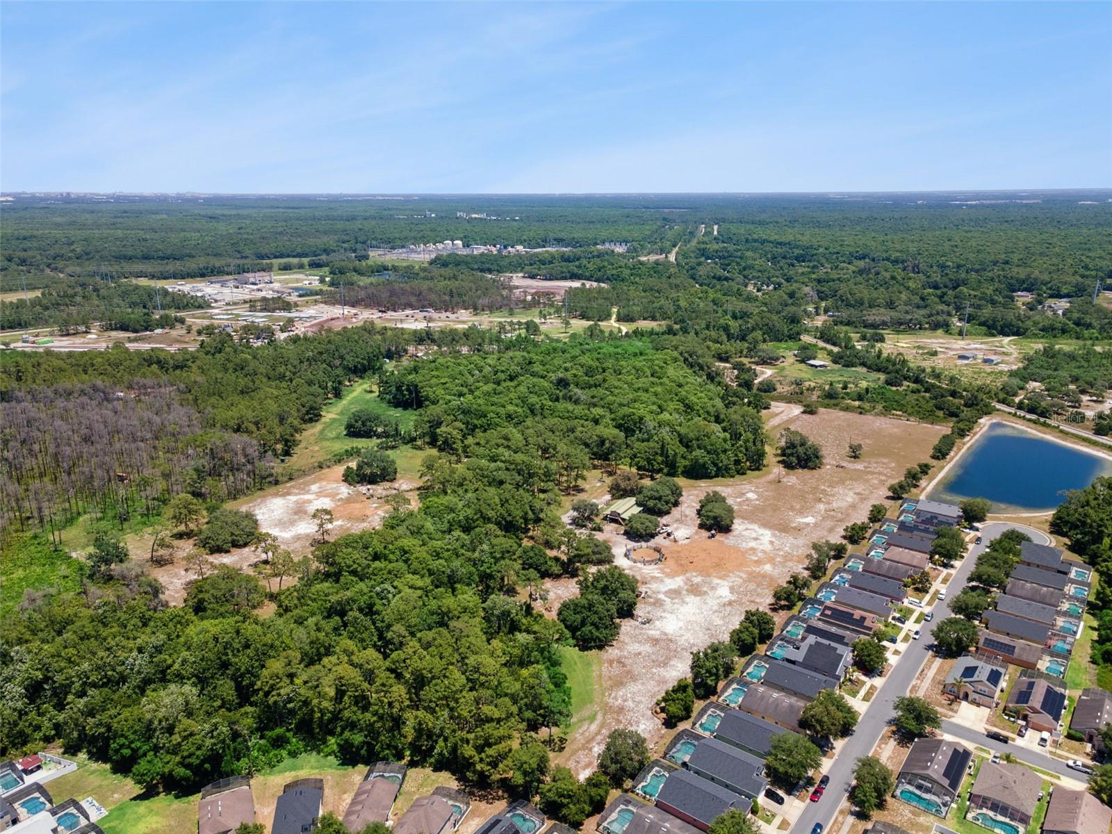 Spanning an impressive 25.49 acres, this expansive parcel offers endless potential for developers, investors, or visionaries ready to bring their next project to life. With a retention pond already in place behind the lot, mostly high-and-dry land, and much of the property already cleared, this site is primed for development and offers a strong foundation for future possibilities. Perfectly positioned and backing up to an established neighborhood, the property offers an ideal setting for a new residential development or thoughtfully planned community expansion. And if purchased along with the lot next to it (G5112272), you would have 30 acres available for your project! Its size, layout, and accessibility create a unique opportunity to capitalize on one of Central Florida’s fastest-growing areas. Location is everything, and this property delivers. Situated just minutes from I-4 and US Highway 17, connectivity is effortless, placing Orlando, Tampa, and surrounding growth corridors within easy reach. You’re also close to ChampionsGate, world-renowned golf courses, Publix, premier shopping, dining, and everyday conveniences**, while Walt Disney World is just a short drive away. As Davenport continues to experience rapid growth and increasing demand, opportunities like this are becoming harder to find. Whether your vision is residential development, future investment, or land banking in a high-growth corridor, this property offers the location, scale, and readiness to make it happen. Don't miss out on this property, contact for more information today!!