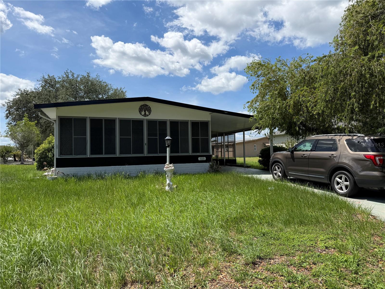 Opportunity awaits in The Villages! This charming 2-bedroom, 2-bathroom home sits on a spacious corner lot in a highly convenient location, offering the perfect chance to add your personal touch and create the home you've always wanted. The home is priced to reflect its current condition and presents excellent value for buyers willing to make a few updates. The flooring between the kitchen and living room needs repair, and the A/C is currently not operational, making this an ideal opportunity for investors, snowbirds, or homeowners looking to customize a property to their taste. Best of all, there is No Bond. Inside, you'll find a comfortable layout with a private primary suite featuring its own bathroom, while the second bedroom provides flexibility for guests, a home office, or hobby space. Recent improvements include a new roof in 2019 and updated windows in 2014, helping reduce some of the major future expenses. Located just minutes from the Golf Cart Bridge to Spanish Springs, you'll enjoy easy access to all the lifestyle amenities that make The Villages so popular, including golf courses, swimming pools, fitness centers, recreation facilities, restaurants, shopping, and countless social activities. With a little vision and updating, this property could become the perfect full-time residence, seasonal retreat, or investment opportunity.