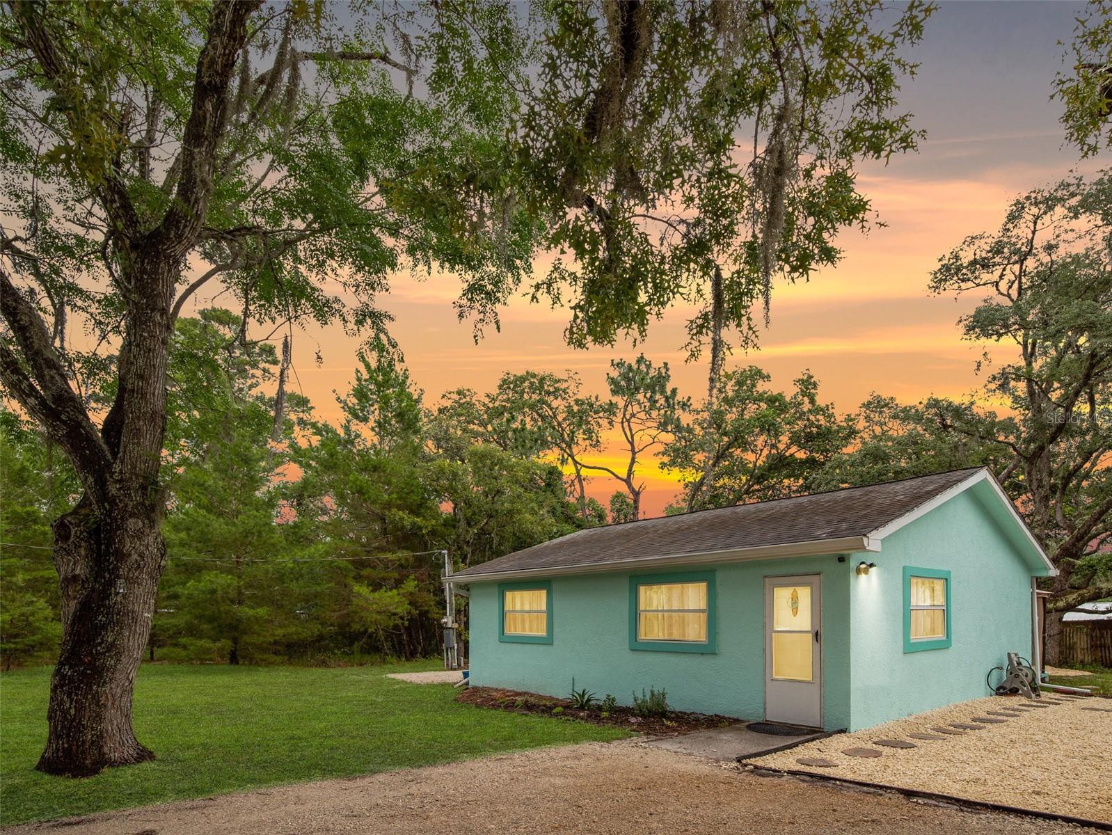 Nestled on .38 Acres in a NON FLOOD ZONE X you can park your boats, RV, and toys all around. All this privacy and tranquility and so close to all the boat launches, fishing spots, and great sunsets! This efficient 624SF cottage layout has 1 Bed and 1 Bath which allows for minimal maintenance and upkeep. HVAC is from 2023 & HW Heater from 2022. Outside has a fire pit, horseshoe/cornhole pit, back deck, and a spot for a hammock. 10x20 RV pad with a 30amp hookup. Plenty of space to start a garden and/or manageable homestead if desired. The shed is 4 years old.  This strategic location is 3 minutes from the Weeki Wachee State Park, 7 minutes from Rogers Park, and 8 minutes from Bayport Park (sunsets on the Gulf!) Short ride to Homosassa and Crystal River also. The cottage has been a solid Airbnb/VRBO for 4 years. 4.94* ratings with 123 reviews. Financials available. Minimal monthly expenses for either an investor or budget conscious homeowner. Weeki Wachee Hills is NOT an HOA but has a private park on the Weeki Wachee River. $100 annual payment is due for all homeowners (shareholders) for ongoing maintenance. Here’s the kicker for an additional fee ($150) you can get a key and use the private park. That is ONLY available to homeowners of this small area (Weeki Wachee Hills) and is NOT transferable to tenants. It’s an unbelievable low-cost perk that allows for overnight camping among other activities.