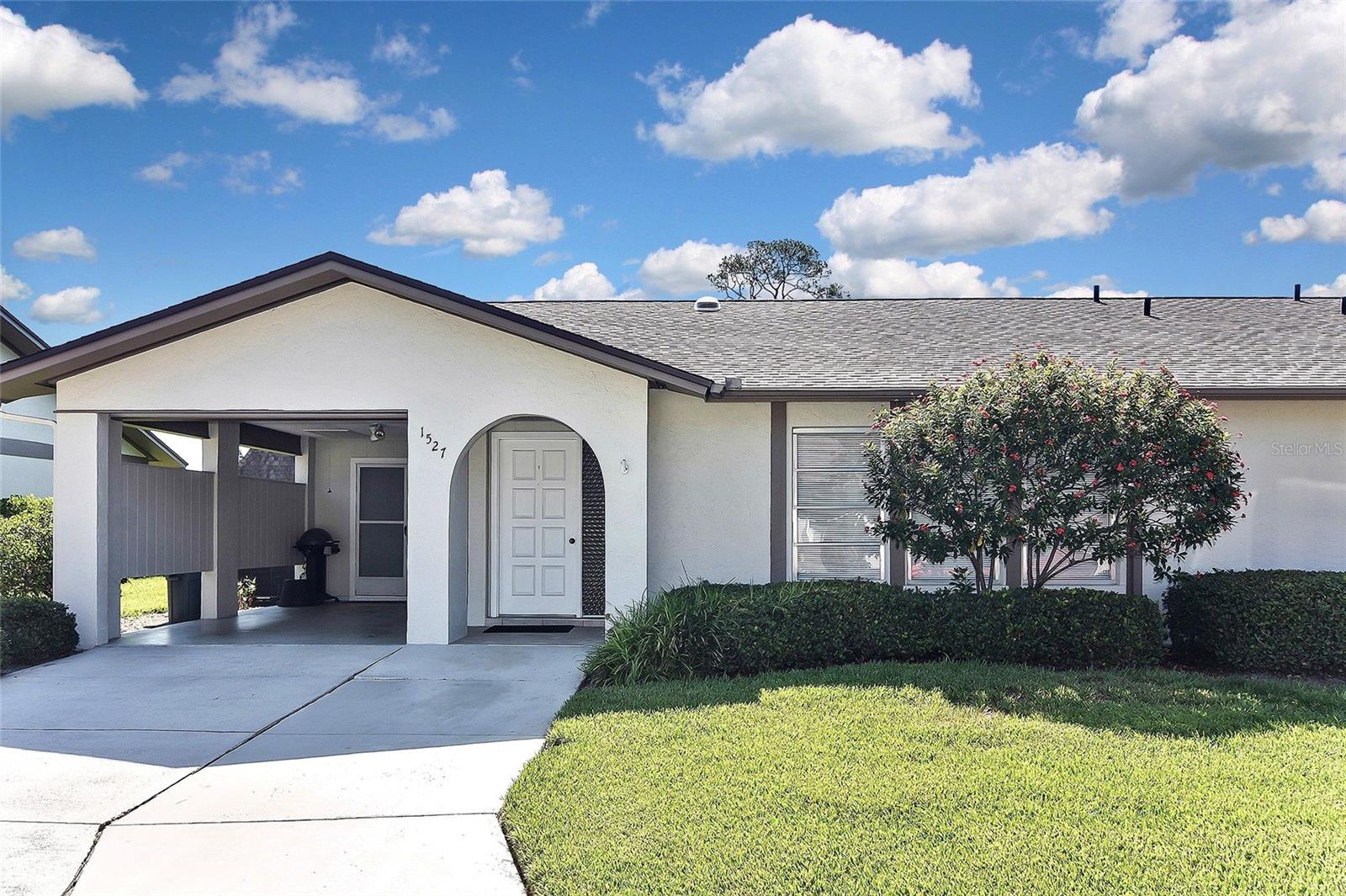 Ready to move in! This 2/2 villa offers a fresh look and plenty of space to spread out! The expanded Florida room under air opens up the living area to a large 1,635 square feet of interior living space. The kitchen features shaker cabinets, quartz countertops and stainless steel appliances. Luxury vinyl flooring throughout. Bathrooms have been updated. Covered carport with extra storage. The villa is steps to community heated pool and recreational center. Centrally located and walking distance to Pinecraft.
