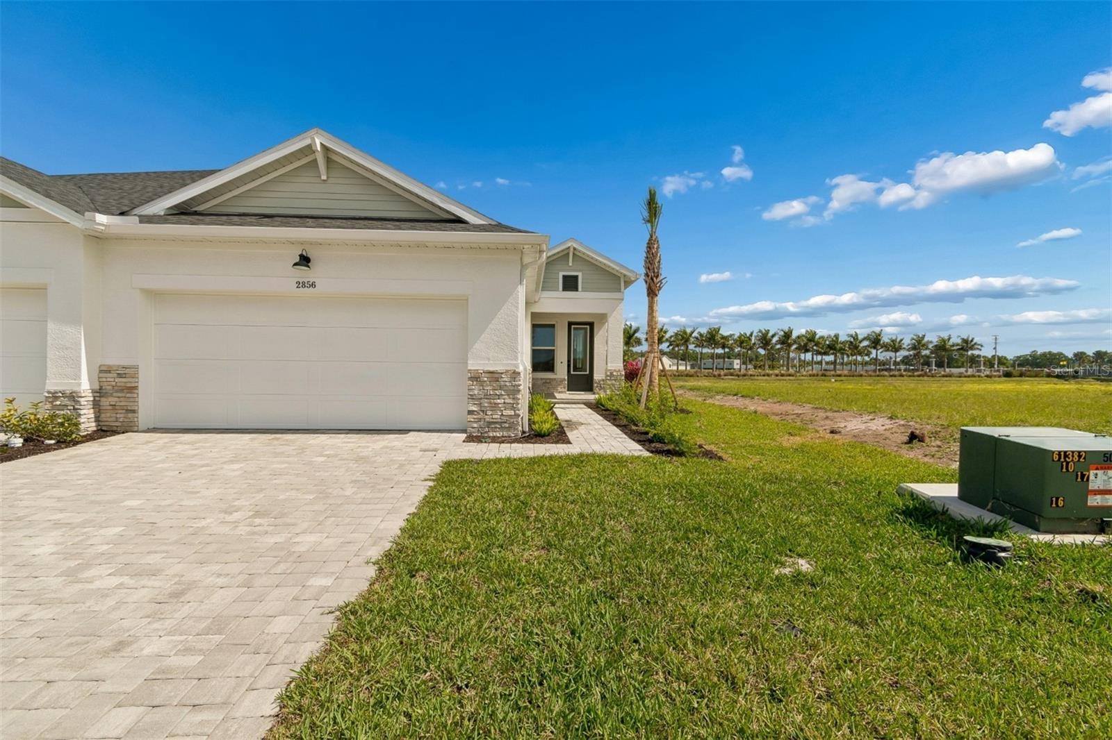 Experience the perfect balance of style, comfort, and top-quality construction in this elegant 3-bedroom, 2-bath “Bishop” plan, located in Sarasota’s sought-after Gracewater community. Designed with open sight lines and a natural flow between the kitchen, dining, and family areas, this home delivers the ideal layout for effortless entertaining and relaxed everyday living.
The designer kitchen is a showpiece, featuring a sleek slide-in gas range/oven, premium finishes, and a spacious layout that makes both cooking and gathering a joy. A large laundry room off the garage doubles as a true mudroom, offering exceptional storage and everyday convenience. The enclosed study with French doors adds flexibility—perfect for a quiet home office, reading retreat, or hobby space.
Your Owner’s Retreat is a serene escape with a spa-inspired bath and generous walk-in closet, while two additional bedrooms provide comfort and privacy for family or guests.
This natural gas community offers tankless water heaters, gas appliances, and impact-rated windows, ensuring energy efficiency, safety, and peace of mind. Step outside to your covered lanai, where you can enjoy the breeze and Sarasota sunshine year-round.
Residents of Gracewater will soon enjoy access to a resort-style amenity center featuring sparkling pools, pickleball courts, a clubhouse with a fitness center, and even an on-site lifestyle director curating events and activities for the community. The HOA maintains all landscaping and amenity upkeep, giving you more time to relax and enjoy everything this exceptional neighborhood has to offer.
Located just minutes from Sarasota’s vibrant shopping, dining, and world-famous Gulf Coast beaches, this home combines modern luxury with low-maintenance living in one of the area’s most desirable new communities. **This property offers a limited-time interest rate incentive.