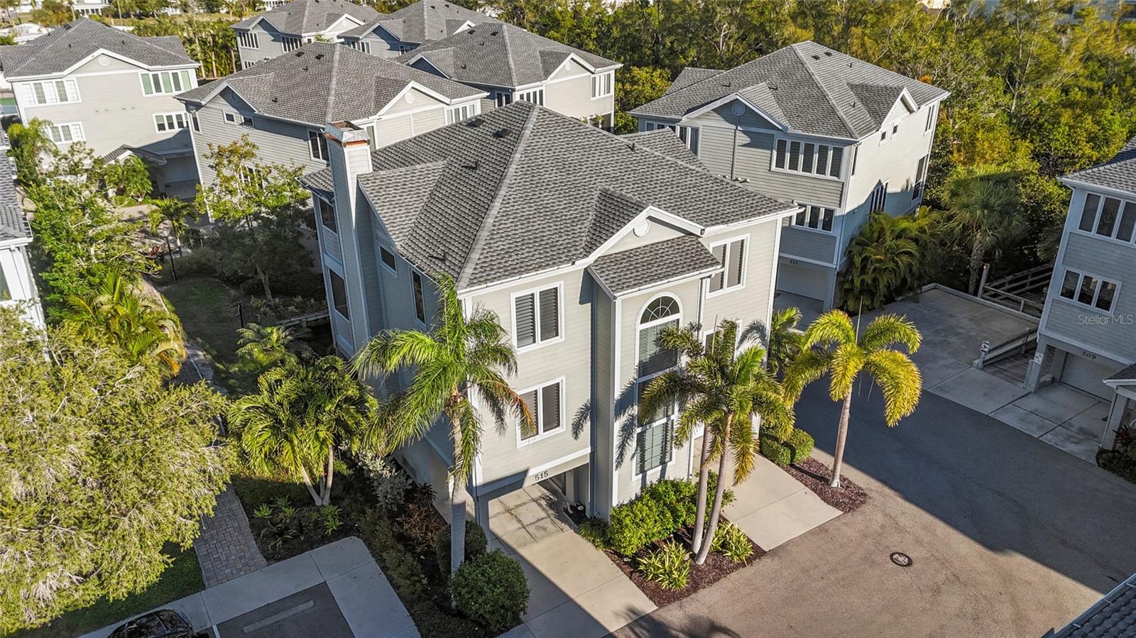 NEW PRICE, AMAZING OPPORTUNITY!!! Experience the ultimate island lifestyle in this masterfully renovated 2,880 sqft, 4 Bed/3 Bath "lock-and-leave" condo at Cedars Tennis Resort and Club. Elevated sanctuary on the tranquil north end of Longboat Key. Offering the expansive feel of a single-family residence with the effortless "lock-and-leave" ease of being in the beautiful condo community of Cedars Tennis Resort and Club. This exquisite 4BR/3BA retreat defines coastal chic. A private elevator serves all three levels, opening into a sun-drenched great room with soaring ceilings, a fireplace, and a gourmet kitchen featuring dual islands and designer finishes. The refined dining room opens right off of this space with its custom built-in cabinetry and dry bar, ideal for any social gathering. Relax on your private, screened lanais overlooking lush tropical foliage and serene ponds, with peek-a-boo views of the Gulf. There is one on each living level. Rounding out the main living area is a versatile den/office (currently used as the 4th bedroom), a full third bathroom, beautiful hardwood floors throughout and a dedicated laundry room. The primary suite is a true oasis with a spa-inspired sunken bath, large walk-in shower, dual vanities and walk-in closets. Upstairs beyond the oasis of a primary there are two additional oversized guest bedrooms and a beautifully renovated guest bathroom with a walk-in shower. Recent updates beyond the full interior renovation include 2026 garage door replacements, and 2024 roof and AC replacement. Hardi- Board siding on exterior and Pella high-impact windows. The split 3-car garage provides total peace of mind and the rare abundance of space and storage. Nestled in the 66-acre village-like townhome community enveloped by nature, providing effortless access to both the beach and the bay on the beautiful north end of Longboat Key. The spacious and tropical community features lit boardwalks winding through mangroves, leading to an array of exceptional amenities including a heated Jr. Olympic Size Pool, nine Har-Tru Tennis Courts, three Pickleball courts, a Clubhouse with a Pro-Shop, a 24-hour Fitness Center, a Tiki bar, a restaurant, a fishing pier, and a kayak launch. Please note that some amenities require an additional club membership. The property is within walking distance to a variety of local attractions, such as Harry's Deli & Continental Kitchen, the true island gem that is Joan Durante Park, Euphemia Haye Restaurant & The Haye Loft, and, of course, Longboat Key's globally renowned sugary white sand beaches. Furthermore, it offers convenient proximity to other major attractions and cultural venues, including St. Armand's Circle, Mote Aquarium, the Asolo Repertory Theatre, Van Zel Performing Arts Center, Marie Selby Gardens, Anna Maria Island, the Ringling Museum complex, and numerous dining options on Longboat Key and in downtown Sarasota. Cedars East is the rare community on LBK that offers shorter-term rental allowance with its 2-week minimum, making it the perfect balance for offsetting costs when not in use, without living in a hotel community. Exceptional onsite management is in place if desired. Fantastic residence, rare opportunity, come take a look today!