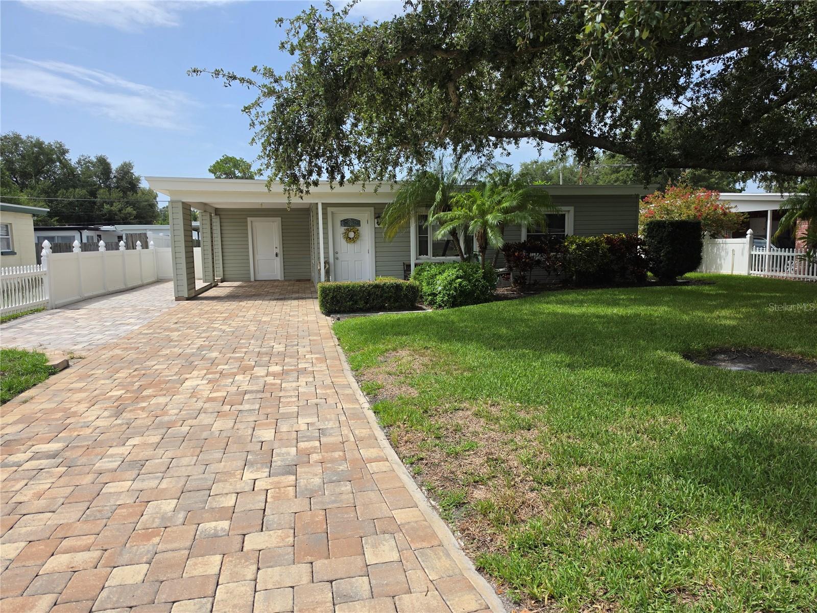 NO FLOOD INSURANCE REQUIRED.
Welcome to your private sanctuary in the heart of highly desirable South Tampa. This beautifully maintained two-bedroom one-bathroom home perfectly blends cozy indoor comfort with an outdoor paradise that is rare for the area.  As you step inside, you are greeted by an abundance of natural light and a thoughtful layout designed for easy living. Situated on a large lot, the backyard features expansive landscaping that creates a lush tropical escape. Whether hosting weekend barbecues or enjoying a quiet morning coffee, the fully enclosed vinyl privacy fence ensures your peace and tranquility. Maintaining this gorgeous green space is effortless thanks to a fully automatic sprinkler system. Home has all new water supply pipes and main and upgraded energy efficient windows and doors. Located just minutes from dining, shopping, Bayshore Blvd, Mac Dill AFB and convenient Selmon Expressway access.