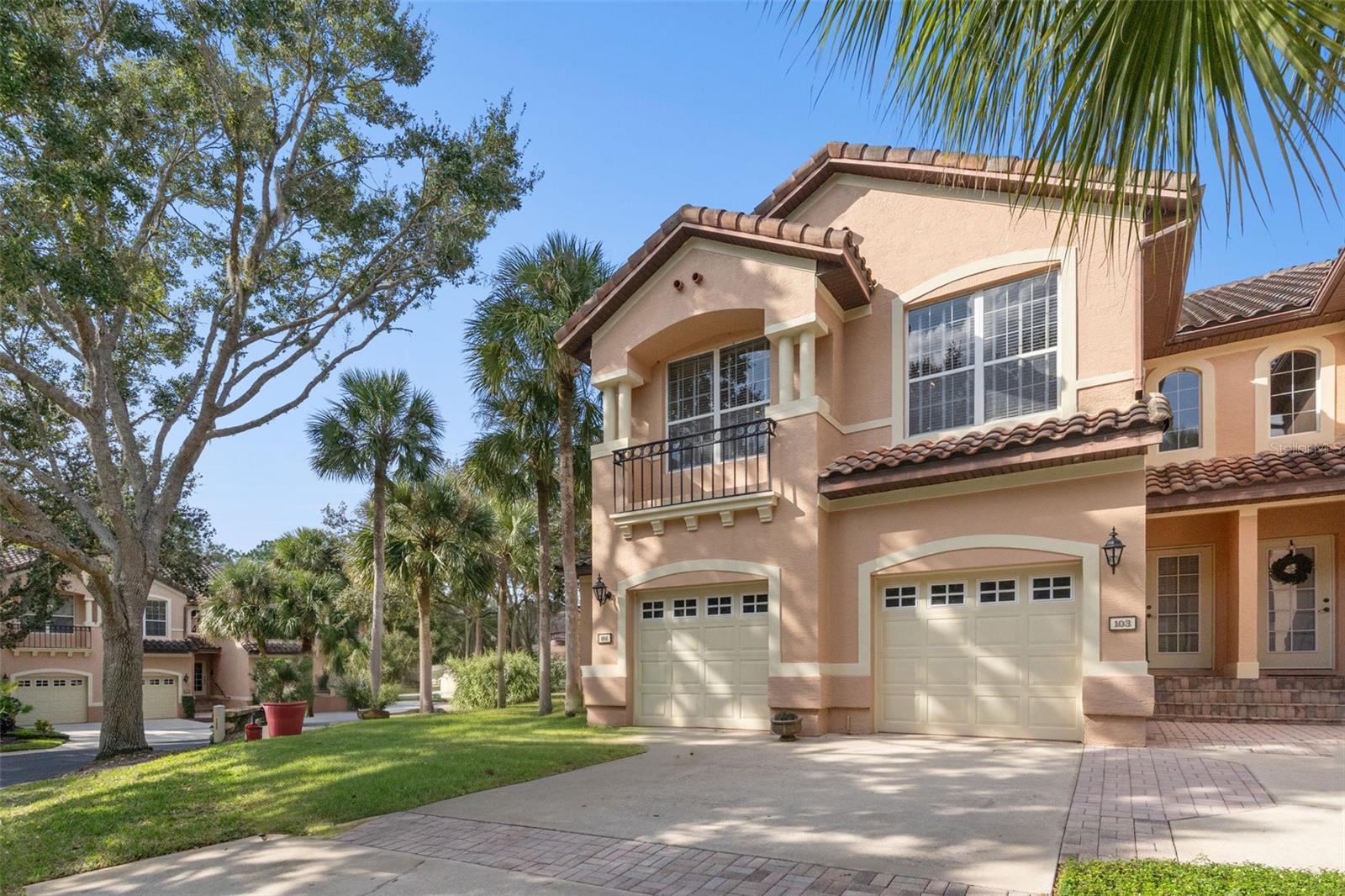 One or more photo(s) has been virtually staged. Wake up surrounded by palm trees, world-class golf, and the peaceful rhythm of resort life. This beautifully positioned second-floor residence offers soaring ceilings, abundant natural light, and a tranquil "treehouse" feel overlooking the pool and lush landscape. Located within the iconic Mission Resort and Club, this home offers more than a place to live- it offers a lifestyle. Enjoy award-winning golf, multiple restaurants, spa services, walking paths, and impeccably maintained grounds. Inside, you’ll love the open floor plan, wood flooring throughout, and tile in the bathrooms. Freshly painted and new AC (2025), all appliances stay, and completely move-in ready! The kitchen features granite countertops, stainless steel appliances, and a new refrigerator (2025). The spacious primary suite includes dual closets with built-in organizers, dual vanities, a soaking tub, and a separate walk-in shower. The versatile second bedroom with a custom-built-in bookshelf is perfect as an office or guest room. The HOA provides full exterior maintenance, including roof, pest control, professional landscaping, and resort-quality upkeep, allowing you to enjoy a truly low-maintenance, lock-and-leave lifestyle. Whether you are a seasonal resident, avid golfer, or someone seeking a peaceful retreat, this residence makes everyday living feel like a getaway. Conveniently located across from a new Publix shopping center (under construction) and just 15 minutes from the Turnpike entrance, this property blends luxury, location, and lifestyle—a rare find in the heart of Howey-in-the-Hills.