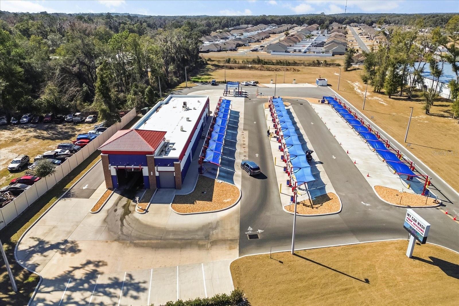 Auction Property. BANKRUPTCY AUCTION
DATE: AUGUST 12TH, 2026
REGISTRATION BY AUGUST 10TH, 2026
STALKING HORSE BIDS DUE: JULY 13TH

Compass Florida is pleased to present an exceptional opportunity for investors or owner-operators to acquire a recently constructed, express car wash business as a going concern, including the underlying real estate, in a rapidly growing area of north-central Florida.
Originally constructed in 2023, the property features a modern express car wash format, including a 140-foot conveyor tunnel, three auto-pay stations, and multiple vacuum stations. The improvements total approximately 5,245 square feet of rentable building area and are situated on nearly four acres with prominent frontage along busy Highway 441.

The property is located in the City of Belleview, Marion County, Florida, within the greater Ocala Metropolitan Area. Belleview benefits from a strategic location just 10 miles south of downtown Ocala and 10 miles north of The Villages. According to the U.S. Census Bureau, the Ocala Metro Area was recently ranked as the fastest- growing metro area in the United States, underscoring the strong demographic and economic tailwinds supporting this offering.

This opportunity provides car wash operators and investors with flexibility to continue the existing operation or pursue a rebranding strategy.
The property is being offered for sale by MY CAR WASH, LLC, as Debtor-in- Possession, pursuant to a Chapter 11 bankruptcy sale (Case No. 3:26-bk-00161- JAB). Any purchase offer is subject to approval by the United States Bankruptcy Court for the Middle District of Florida and will be conducted in accordance with Chapter 11 of the U.S. Bankruptcy Code.