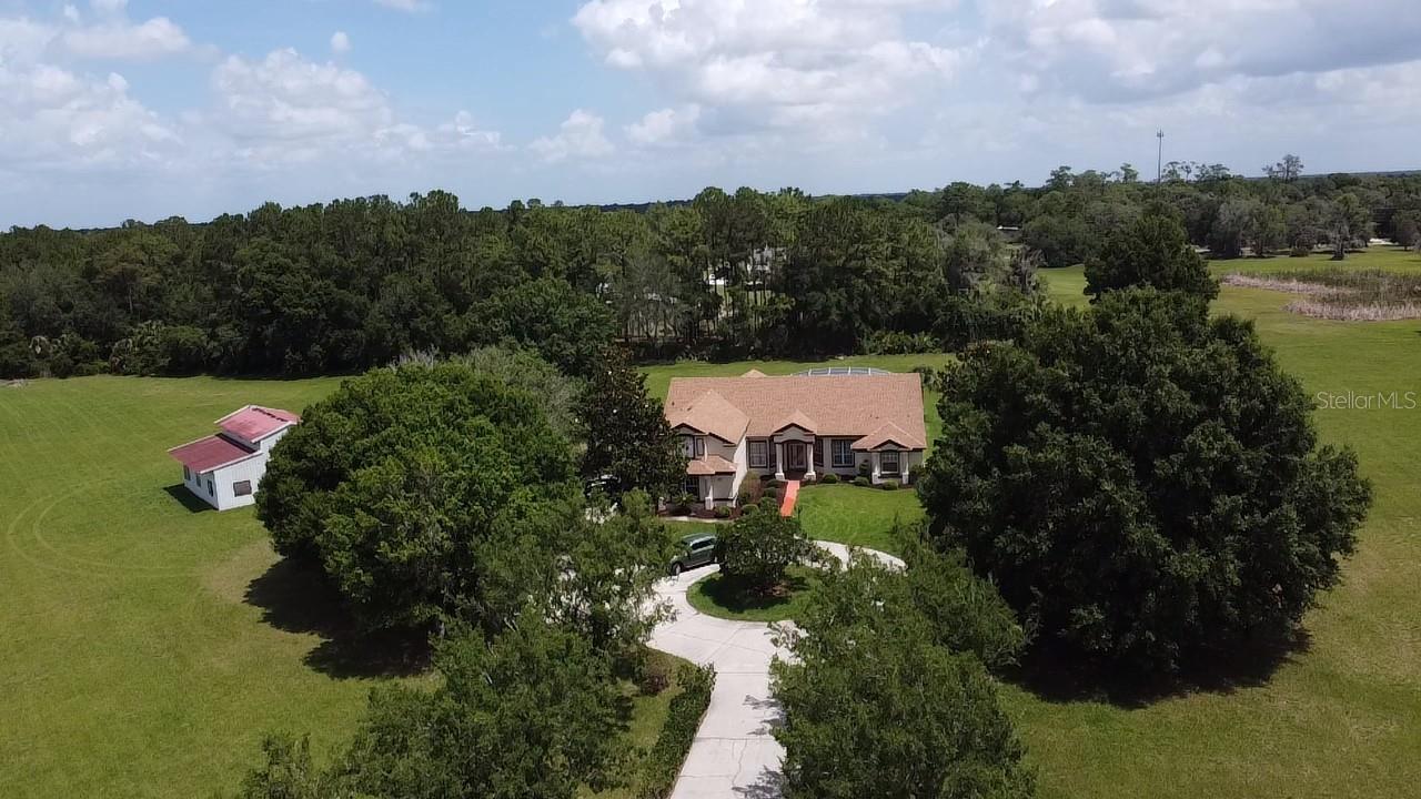 Bring your horses to this very private 5 acre estate with direct access to all the horse trails in the 33000 acre Seminole State Forest. 3912 Sq Ft block home on 5 acres with 4 stall barn including feed and tack room, minutes from 429, I-4 and Seminole Town Center.  Split plan with main bedroom on first floor adjacent to the oversized screened pool. 2 car garage. This home is at the end of a very private road and offers lots of privacy yet very close to many great restaurants and shopping.