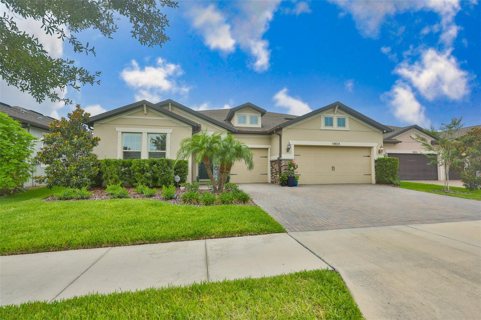 Stunning large residence in Birchwood Preserve, one of Lutz’s most desirable gated communities with one of Hillsborough County’s most sought-after A-rated school districts. This beautiful 6 bedroom/4 bath home is tucked back into a quiet street with a higher elevation in the community but still enjoys easy access to all the neighborhood amenities. Built in 2018, this special floor plan gives you a 1st floor primary along with 3 other bedrooms, a spacious kitchen, great room, dining room and laundry room. Once you go upstairs you have another large family room that can be used in so many ways. There are two additional bedrooms with custom closets and a jack and jill bathroom as well. If you like to entertain, you are going to love the amazing kitchen offering 42" white cabinets, large island, custom herringbone backsplash and quartz countertops, built-out pantry, reverse osmosis system and coffee bar. The beautiful lighting has been upgraded along with crown molding throughout and an extension of the doors out to a peaceful screened patio and fenced backyard which complete the family and the entertainment friendly spaces beautifully. The primary retreat looks out to the private back yard and is filled with light. The bathroom has a spacious glass shower with multiple shower heads, water closet and double vanity that leads into a large custom closest. The house is filled with great storage and organization solutions with multiple linen closets, under stair storage, and a 3-car garage with finished flooring and drop-down ceiling storage. Upgrades are too numerous to count but include: updated landscaping, new LVP throughout 2nd floor, upgraded bathroom with soaker tub, full home water softener, UV protection for windows, electric shades, plantation shutters, monitored security system with 4 exterior cameras, keyless entry, and permanent outdoor lighting controlled by an app on your phone. Residents of Birchwood Preserve enjoy access to beautifully maintained community amenities, including a resort-style swimming pool, playground, and walking paths — all within a secure gated setting that fosters a true neighborhood feel. Conveniently located near McKitrick Elementary School, Lutz Preparatory School, Martinez Middle and Steinbrenner High School. This property is also conveniently located just off Dale Mabry Hwy with no CDD fees and easy access to shopping, parks, as well as the Dale Mabry connector exit to and from the Veterans Expressway! Make an appointment to see this fabulous home today!