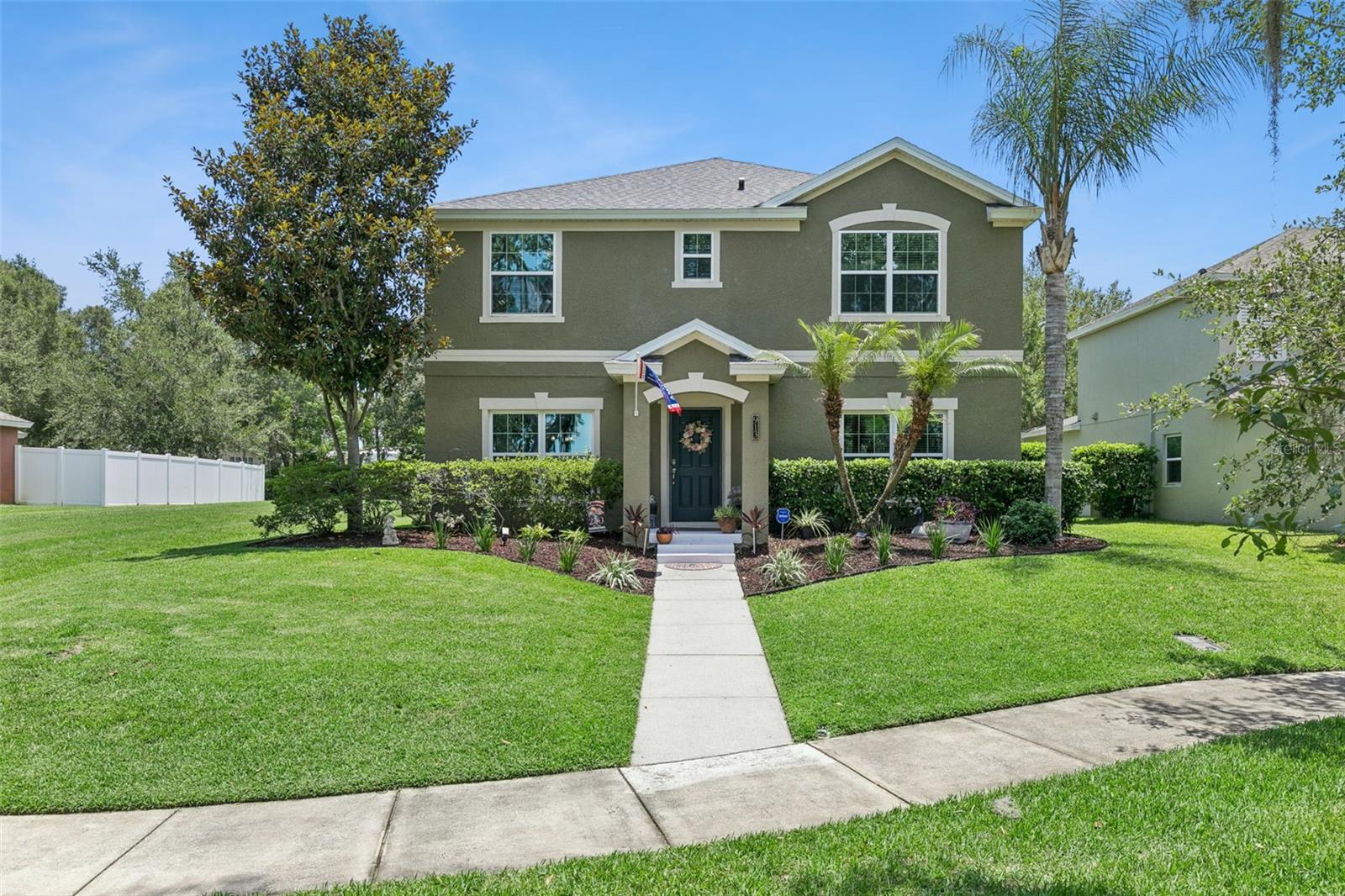Located in Winter Garden’s sought after Golf Cart District, this spacious two story home offers a flexible floor plan and a convenient location close to downtown shopping, dining, entertainment, parks, and local events. A welcoming front elevation and beautifully maintained landscaping create great curb appeal, while the oversized homesite provides added outdoor space and privacy. Inside, the open concept layout is designed for both everyday living and entertaining. The kitchen features abundant cabinetry, generous counter space, and a large breakfast bar overlooking the living and dining areas. Sliding glass doors lead to a screened lanai and fully fenced backyard, creating an ideal space to enjoy Florida’s outdoor lifestyle. A first floor bedroom with an adjacent full bath offers flexibility for guests, a home office, or multi purpose use. Upstairs, the remaining bedrooms are thoughtfully arranged to provide comfortable separation of space. Recent updates include a newer AC system and a roof that is approximately one year old, offering added peace of mind. Conveniently located with easy access to major roadways, shopping, dining, recreation, and everything that makes Winter Garden one of Central Florida’s most desirable destinations, this home combines space, functionality, and location in one exceptional opportunity.