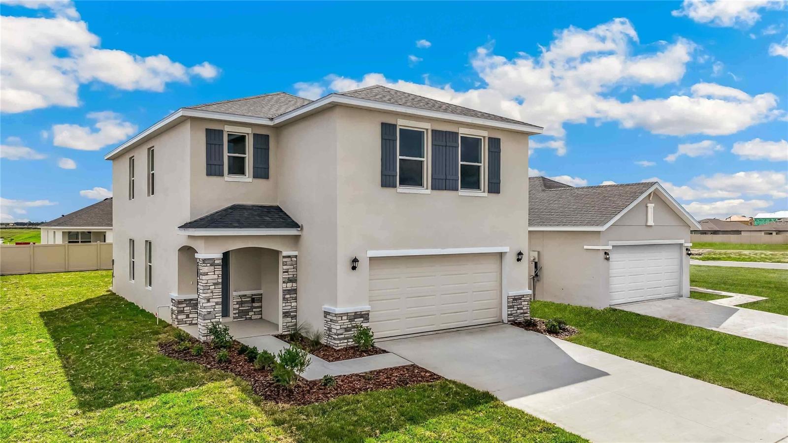 Under Construction. Receive up to $10,000 towards closing costs & special interest rates with the use of our preferred lender - Now through Sunday, August 2nd. 
Welcome to Seaire, our newest single-family home community where luxurious living meets a vibrant coastal lifestyle. Situated in the center of Parrish, Florida, Seaire offers a blend of modern convenience, resort-style amenities, and a warm, welcoming neighborhood atmosphere. At the heart of Seaire lies a breathtaking 4.5-acre crystal-clear lagoon, the centerpiece for relaxation and recreation. Whether you’re seeking adventure or a serene escape, the lagoon offers something for everyone. Start your day with a kayak or paddleboard outing across shimmering waters. Cabana Cove, complete with a private bar, provides the ultimate laid-back retreat, while our swim-up lagoon bar lets you enjoy refreshing beverages without leaving the water. The entire family will love Gasparilla Island featuring a splash pad, water obstacle course, and superslide. Seaire is designed for year-round enjoyment with exclusive resident events, from fitness and wellness classes to seasonal holiday celebrations and live music performances.
