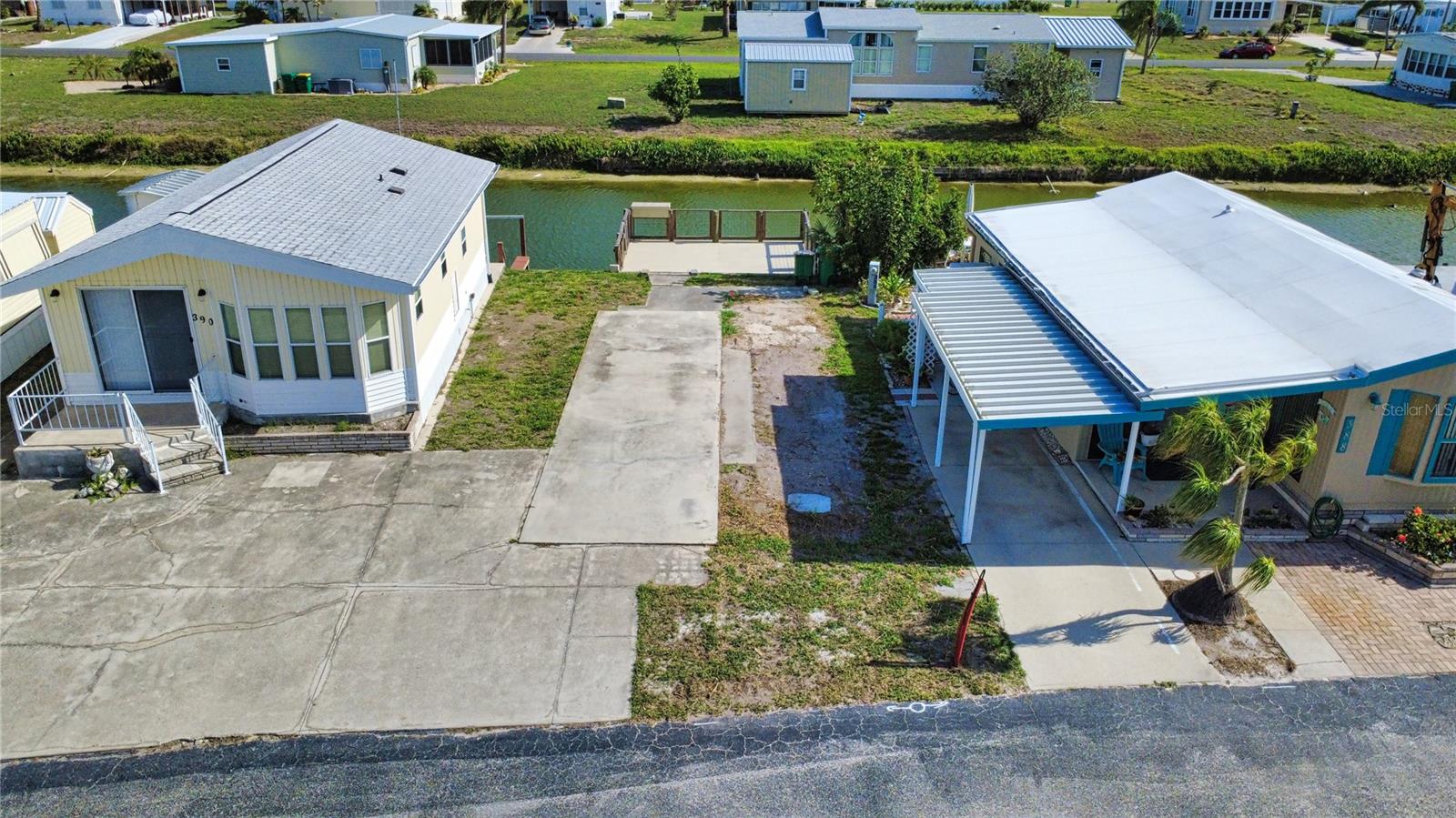 Welcome to your slice of paradise in one of Englewood’s most desired 55+ gated communities! Just 10 minutes from the sandy shores of Englewood Beach and Manasota Key, this RV-ready waterfront lot offers the perfect blend of Florida relaxation, coastal charm, and vibrant community living.

Enjoy peaceful canal views from your newer 10x30 dock — ideal for fishing, kayaking, morning coffee, or simply watching the wildlife and beautiful Florida sunsets unfold. Whether you’re bringing your RV for seasonal living or dreaming of creating your own tropical retreat, this mixed-use zoned lot gives you the flexibility to make it your own.

Life here feels like a year-round vacation with golf cart-friendly streets, friendly neighbors, and endless activities during season. Residents enjoy access to a community pool, clubhouse events, pickleball, bocce ball, card games, dances, concerts, craft fairs, holiday golf cart parades, laundry facilities, and so much more.

Whether you're a retiree searching for sunshine and relaxation or a snowbird looking for the perfect winter getaway, this property offers the laid-back beach town lifestyle you’ve been waiting for. Come experience the fun, friendship, and coastal living that makes this community so special!