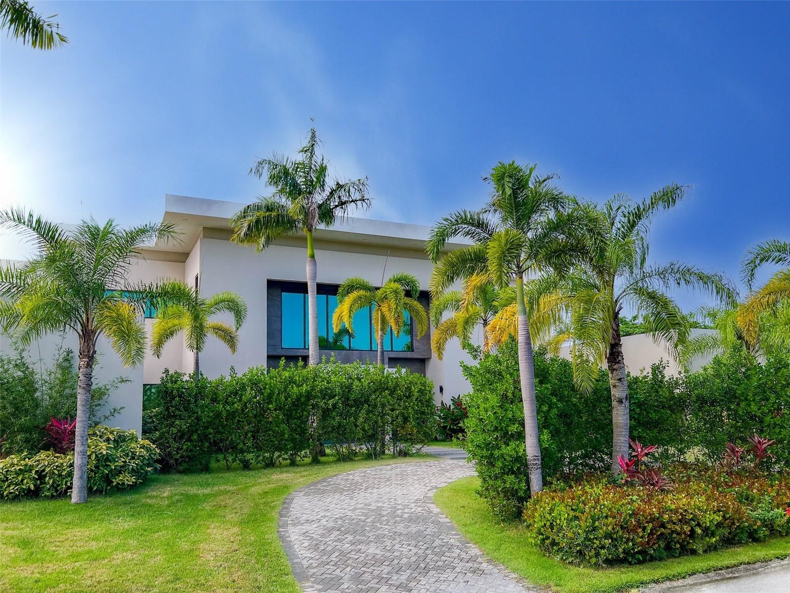 Brand new luxurious contemporary home with 9,500 sqf of air-conditioned living space for the discerning buyer.  This architectural masterpiece, designed by renowned architect Jose Garcia, is surrounded by high-end multi-million dollar homes based in the sought after community of Dorado Country Estates, with direct golf cart access to the exclusive Dorado Ritz Carlton Resort.
Inside living includes a great room and massive kitchen/waterfall island which anchors the home, and overlook the gorgeous landscaped gardens.  These rooms are complemented by a walk-in pantry, a family room and formal dining room, plus a ground floor guest suite.  Luxury, high-end finishes include Subzero and Wolf appliances, European tile, custom Italian cabinetry, Kohler wall hung toilets and fixtures, and is equipped with Trane central air conditioning, a 60kw diesel generator and 1,200 gallon cistern.  The Master Suite is a stunning retreat with views of the gardens, an over-sized walk-in Italian closet, walk-in shower, gorgeous tub, and Scavolini vanities!  All bedrooms are en-suite with tiled walls and walk-in showers.  This beautiful estate consists of 12,000+ sqf construction space and sits harmoniously on a 3,000 sq meter lot (.75 acre).  The outdoor living area includes a covered patio and bathroom, and the home boasts two separate garages.