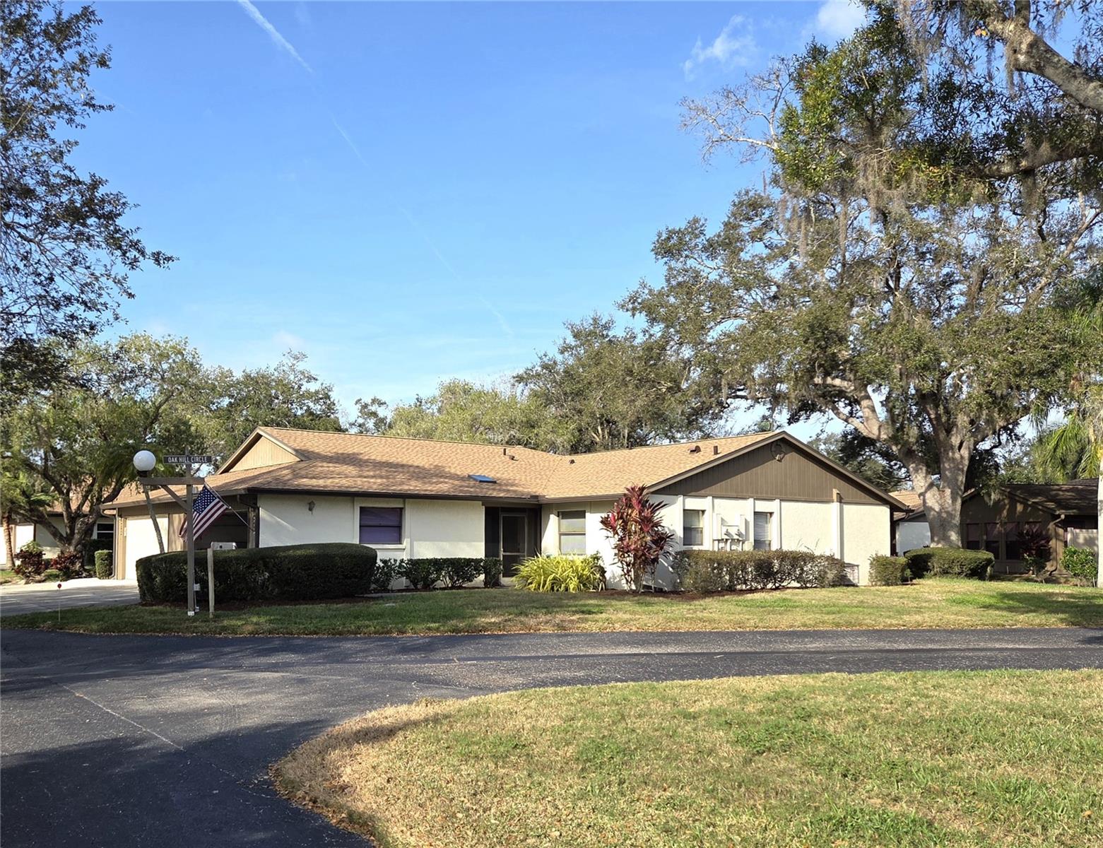 Lovingly well-maintained end unit!  Updates include added laminate flooring, an enclosed 21 x 9 Florida Room, and inside laundry!  This floorplan features walk-in closets in both bedrooms, a pass-through to dining and the "must have" 2 car garage.  The dishwasher, water heater, washer/dryer and garage door have all been replaced in the last 3-4 years.  The air conditioning system is around 4 years old!  4735 Oak Hill Dr is situated near the rear community near the clubhouse and pool facilities.  Fantastic lake views across the street as well.
