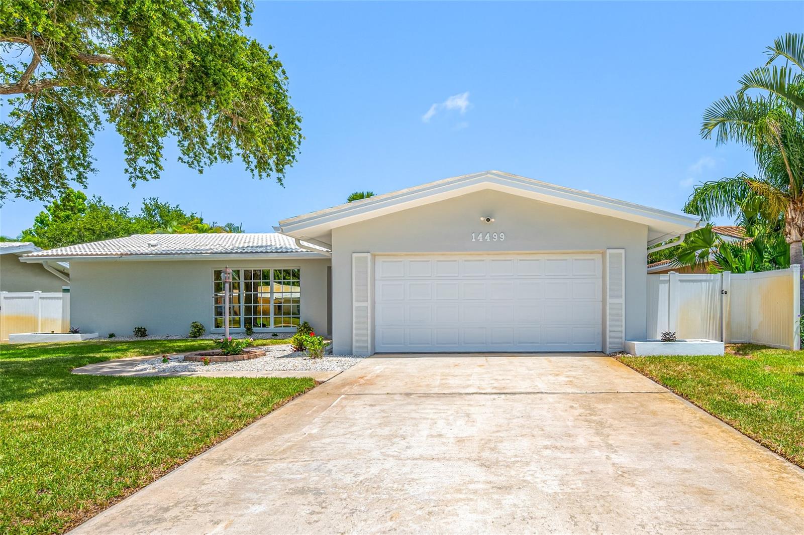 Welcome to this beautifully renovated 3-bedroom, 2-bathroom home in the highly coveted Imperial Point neighborhood. Ideally located just a 5-minute drive to Indian Rocks Beach and everything the Gulf Coast lifestyle has to offer, including award-winning restaurants, waterfront bars, shopping, parks, and entertainment.

This stunning renovation featuring high-end finishes throughout. The heart of the home is the open-concept chef's kitchen, showcasing semi-custom solid birch slim shaker cabinetry finished in a timeless Pearl White, complete with soft-close doors and dove tail drawers. The kitchen is further enhanced with luxurious Calacatta quartz countertops, a designer tile backsplash, premium LG stainless steel appliances, and two oversized breakfast bars with generous overhangs, providing abundant seating for family and guests while creating the perfect space for entertaining.

Throughout the home you'll find new luxury vinyl plank flooring complemented by elegant 5-inch baseboards, creating a clean, modern look. Fresh interior and exterior paint, along with custom millwork including double crown molding, chair rail, and picture-frame molding, add architectural character and sophistication to every room.

The spacious primary suite serves as a private retreat with a completely redesigned luxury bathroom featuring raised ceilings, recessed lighting, a custom walk-in shower, and a double vanity with quartz countertops, all finished with designer touches.

Step outside to your own private backyard oasis. Surrounded by mature palm trees lining the fence, the backyard offers exceptional privacy and a true tropical setting. Enjoy new sod and professional landscaping, along with a brand-new custom paver patio, creating the perfect outdoor space for relaxing, entertaining, or enjoying Florida's beautiful weather year-round. Whether you're looking for a primary residence, vacation home, or investment property, this exceptional home delivers the Florida lifestyle you've been dreaming of. Finding a fully renovated, move-in-ready home of this caliber in Seminole—especially in a non-flood zone—is an exceptional opportunity. Combining luxury finishes, quality craftsmanship, a private oasis backyard, and an unbeatable location, this home truly stands apart. Homes like this are in high demand, so don't wait—schedule your private showing today and experience everything this incredible property has to offer before someone else does.