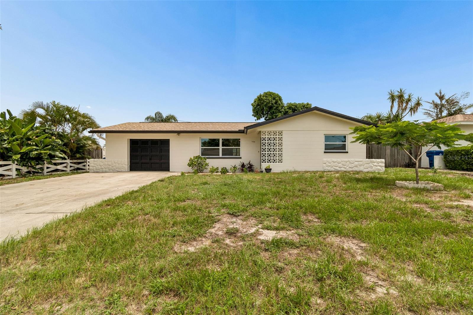 Welcome to this charming Seminole home offering comfort, character, and an unbeatable location just minutes from the Gulf beaches, parks, shopping, and dining. This 2-bedroom, 2-bath residence features an open-concept living and dining area filled with natural light, creating an inviting space for everyday living and entertaining. The spacious backyard is perfect for relaxing, gardening, or hosting family and friends, complete with mature oak, and mango trees. A Florida room provides additional flexible living space, while the attached garage offers extra storage and convenience. Situated in a non-deed-restricted neighborhood with no HOA, this property is ideal as a primary residence, vacation home, or investment opportunity. Enjoy easy access to Seminole City Center, and top-rated schools.