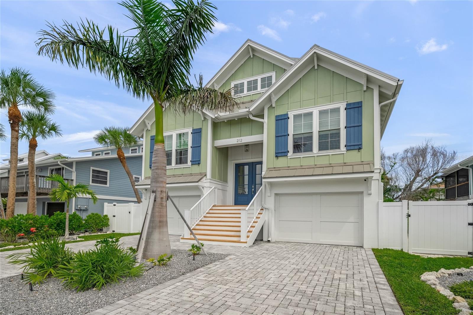 Welcome to your slice of paradise—this breezy, 4-bedroom, 4.5-bath island retreat is just one block from the powdery white sands of world-famous Anna Maria Island beaches. This home was built by Moss Builders and thoughtfully designed by Emily Moss Designs with both comfort and style in mind, this coastal home invites you to unwind in true island fashion.
Take a dip in your private pool and spa surrounded by low-maintenance landscaping and turf—perfect for barefoot afternoons. Enjoy Gulf breezes and sunset views from the rooftop deck or sip your morning coffee on one of the covered balconies.
Inside, an open-concept living, dining, and kitchen space makes entertaining a breeze. Each of the 4 bedrooms has its own ensuite.  The home is equipped with an elevator and 2-car garage for added ease and convenience.
With a champagne metal roof, thoughtfully designed indoor-outdoor living spaces, and privacy throughout, this home offers everything you need to settle into the laid-back island life.