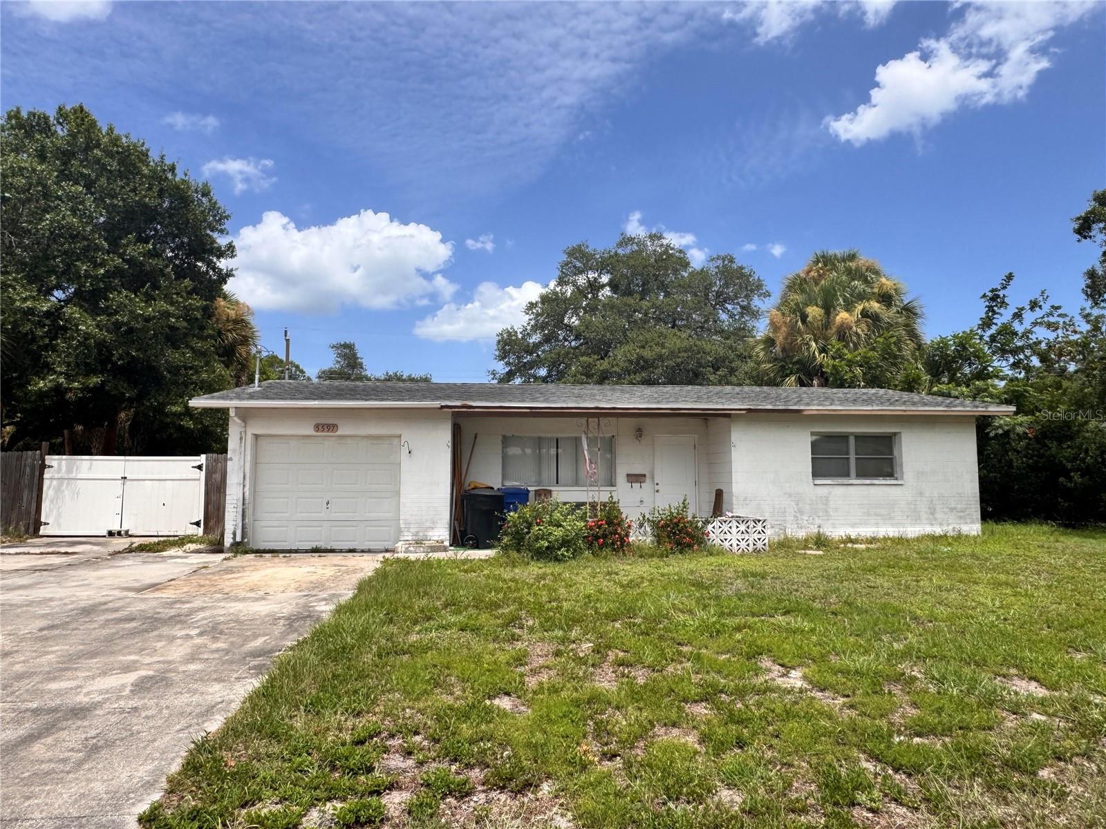 Unleash the potential of this Northeast St. Petersburg fixer-upper! This block home features 2 bedrooms, 1 bathroom, and a 1-car garage. The 1036 sqft floor plan includes a spacious living/dining room combo, a Florida room on the back side of the house, terrazzo flooring throughout the majority of the house, and the kitchen was replaced after the 2024 hurricane season. The property is in need of rehabilitation, making it the ideal blank canvas for a profitable fix-and-flip, a long-term rental addition, or a custom renovation.