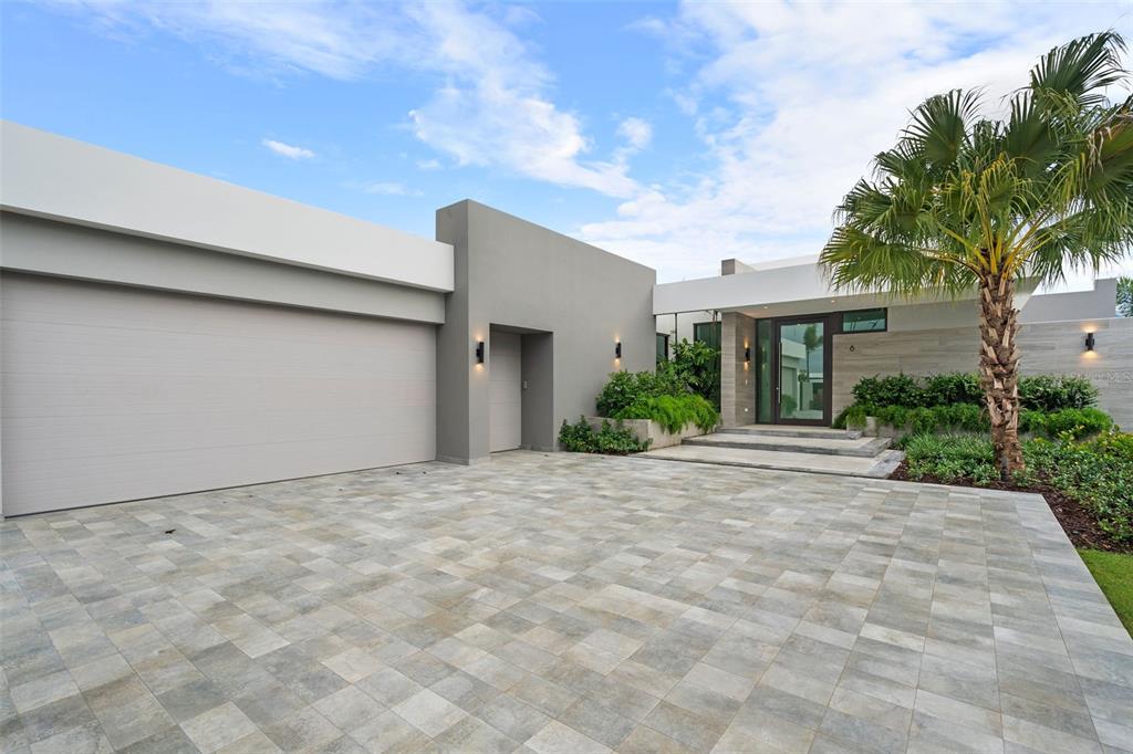 Brand new construction, one story, spacious home is located within the heart of the Sugarcane Golf Course. This four bedroom, four bathroom residence is immaculate and full of upgrades. Living is easy with an open floor plan. The main level entry with vaulted high ceilings leads to a formal dining room and spacious living room with recessed lights. The modern Italian-designed kitchen is the heart of the home, complete with large customized stone quartz countertops, a walk-in pantry, Thermador appliances, and light grey wood cabinetry.
The large master bedroom suite includes a spa bath with a soaking tub, separate shower, dual bowl vanity, and a private entrance to the backyard with an infinity edge pool. This modern residence also has a community shared power generator and solar water heater! A gorgeous landscaped yard and unlimited lake views will enchant you. Sit back, enjoy and call this your new home. Endless amenities await you at Dorado Beach Resort. This Isle is conveniently located to prime amenities such as golf courses, restaurants, a water park, fitness center, and many more!