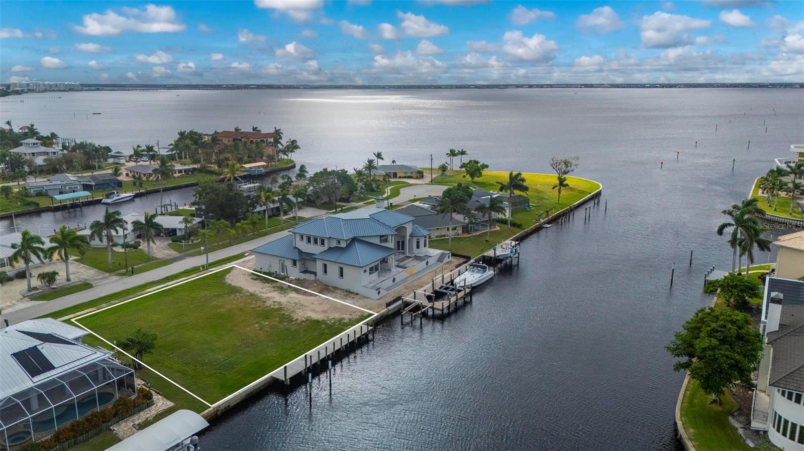 LOCATION, LOCATION, LOCATION!
Just four lots from the open waters of Charlotte Harbor, this 100’ x 125’ (.29-acre) sailboat-access waterfront lot with no bridges is a boater’s dream and a rare opportunity to build your perfect Florida retreat or secure a premium waterfront investment.
The property features a wide 140 ft. canal and a new 100 ft. concrete seawall installed in 2021, designed with 110’ of 5’x12’ sections—including a 5’ setback on each end to protect against potential adjoining seawall issues. You’ll also find a 60’ x 7’ reinforced concrete dock supported by concrete pilings, with ten 8” pilings spaced along the dock and four 10” pilings set in place for a future boat lift. This setup offers a strong, durable, and ready-to-use waterfront infrastructure ideal for sailboats, powerboats, or kayaks.
Enjoy partial views of Charlotte Harbor from your future backyard and quick access to open water—perfect for fishing, cruising, or sunset sails. The lot is located among beautiful estate homes and includes public water, sewer, sidewalks, and utilities in place, allowing you to start building immediately.
You’ll love the convenient location—just 1.5 miles from shopping, 2 miles from the Port Charlotte Beach Complex, and minutes from the new Sunseeker Resort by Hilton and historic downtown Punta Gorda, offering waterfront dining, boutique shops, entertainment, and year-round events.
Whether you’re seeking the ultimate boating property, planning your custom waterfront estate, or making a smart investment in Southwest Florida’s coastal lifestyle, this Beeney Road homesite delivers the best of location, access, and quality construction.
Don’t miss this rare opportunity to own a premier waterfront property with everything already in place!