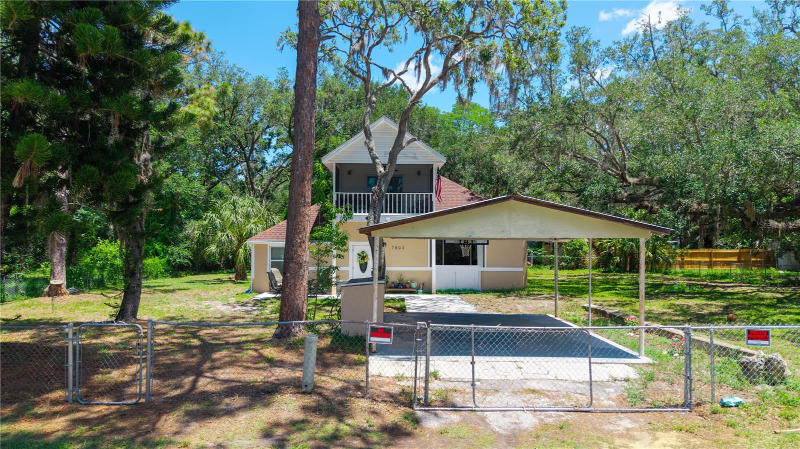 This home has a large fenced yard with a carport conveniently located near the front door. The home has a new water filtration system and the septic was updated by the previous owner. The home has a split level floor plan complete with Fireplace and Updated Kitchen. This home offers a number of unique features that you have to see for yourself. The Primary suite is on the second floor with a screened balcony off the bedroom and a spacious bathroom with a walk in shower. The second and third bedroom are on the first floor/ The living room and dining room are a few steps above the main floor and these rooms have the same continuous tile flooring and a fireplace. Room measurements are approximate and the buyer is responsible to verify.