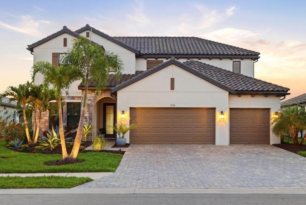 New Price!! *Exceptional Value!!*  Luxury, space, and thoughtful upgrades come together in this Exceptional Juniper floor plan in the sought-after Sweetwater community of Lakewood Ranch. Offering more than 3,650 square feet of beautifully designed living space on a premium preserve homesite, this four-bedroom, three-and-a-half-bath residence delivers the feel of a model home with upgrades rarely found in competing resale properties. Wake each morning to breathtaking sunrise views while enjoying the privacy of a tranquil preserve setting. Designed for both everyday comfort and effortless entertaining, the open-concept floor plan features soaring 9-foot ceilings, elegant tray ceilings, 8-foot interior doors, and an abundance of natural light throughout. At the heart of the home is a stunning chef's kitchen overlooking the spacious great room and dining area. Curated upgrades include a fireclay farmhouse apron sink, custom dry bar, designer lighting, plantation shutters and custom shades, whole-house water filtration, reverse osmosis drinking water, and luxury vinyl plank flooring throughout - absolutely no carpet. The first-floor primary suite is a private retreat featuring a tray ceiling, abundant natural light, an oversized glass-enclosed shower, dual vanities, and an expansive custom walk-in closet designed to impress. A dedicated den provides the perfect space for a home office, library, or flex room. Step outside to the extended covered lanai, where a fully equipped custom outdoor kitchen creates the perfect setting for year-round Florida entertaining, weekend cookouts, and evenings with family and friends. Upstairs, a spacious loft offers endless flexibility as a media room, game room, or second family room. Three generously sized guest bedrooms, all with walk-in closets are complemented by two full bathrooms, including a private en-suite that creates an ideal guest retreat. Additional premium upgrades include a whole-home generator, custom walk-in pantry, seamless gutters surrounding the home, professionally designed landscaping, and architectural landscape lighting that enhances both curb appeal and evening ambiance. Just steps from your front door, enjoy Sweetwater's outstanding resort-style amenities, including a heated pool, pickleball courts, fitness center, clubhouse, and playground. Perfectly positioned just minutes from top-rated schools, premier sports facilities, the UTC shopping and dining district, and the world-renowned Gulf Coast beaches, this home offers the ideal combination of luxury, convenience, and lifestyle. Why wait months for new construction when this extensively upgraded, move-in-ready home is available today? Offering exceptional value, designer finishes, and an unbeatable location, this is a rare opportunity to enjoy Florida living at its finest. If entertaining family and friends is on your wish list this summer, you've found your home.